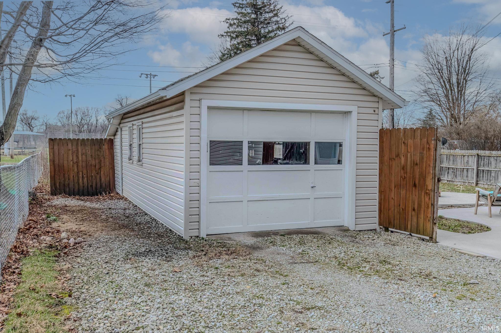 Detached garage featuring driveway