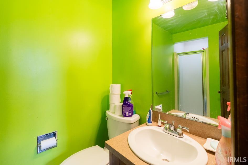 Bathroom featuring vanity and a stall shower