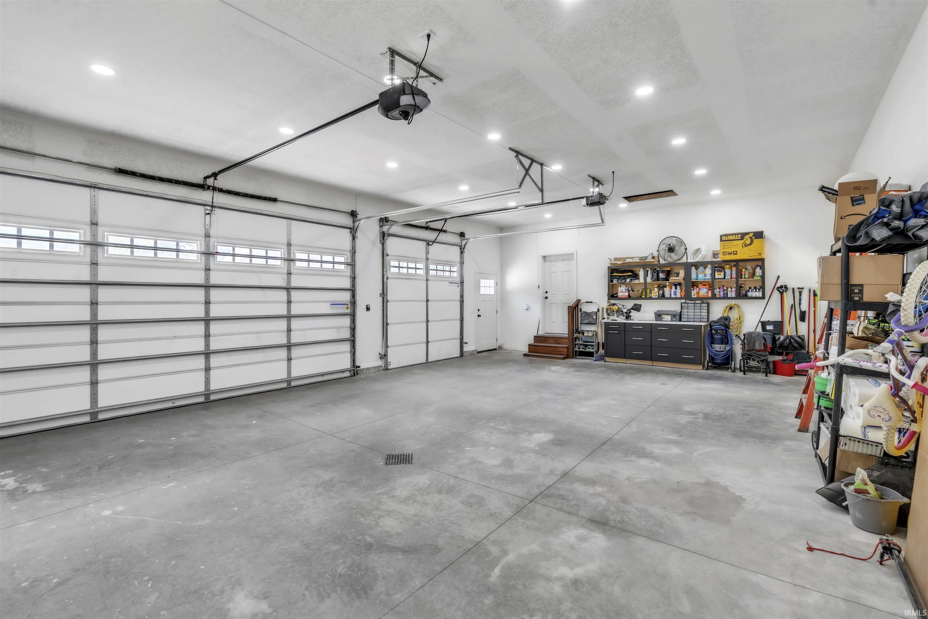 Garage featuring a garage door opener