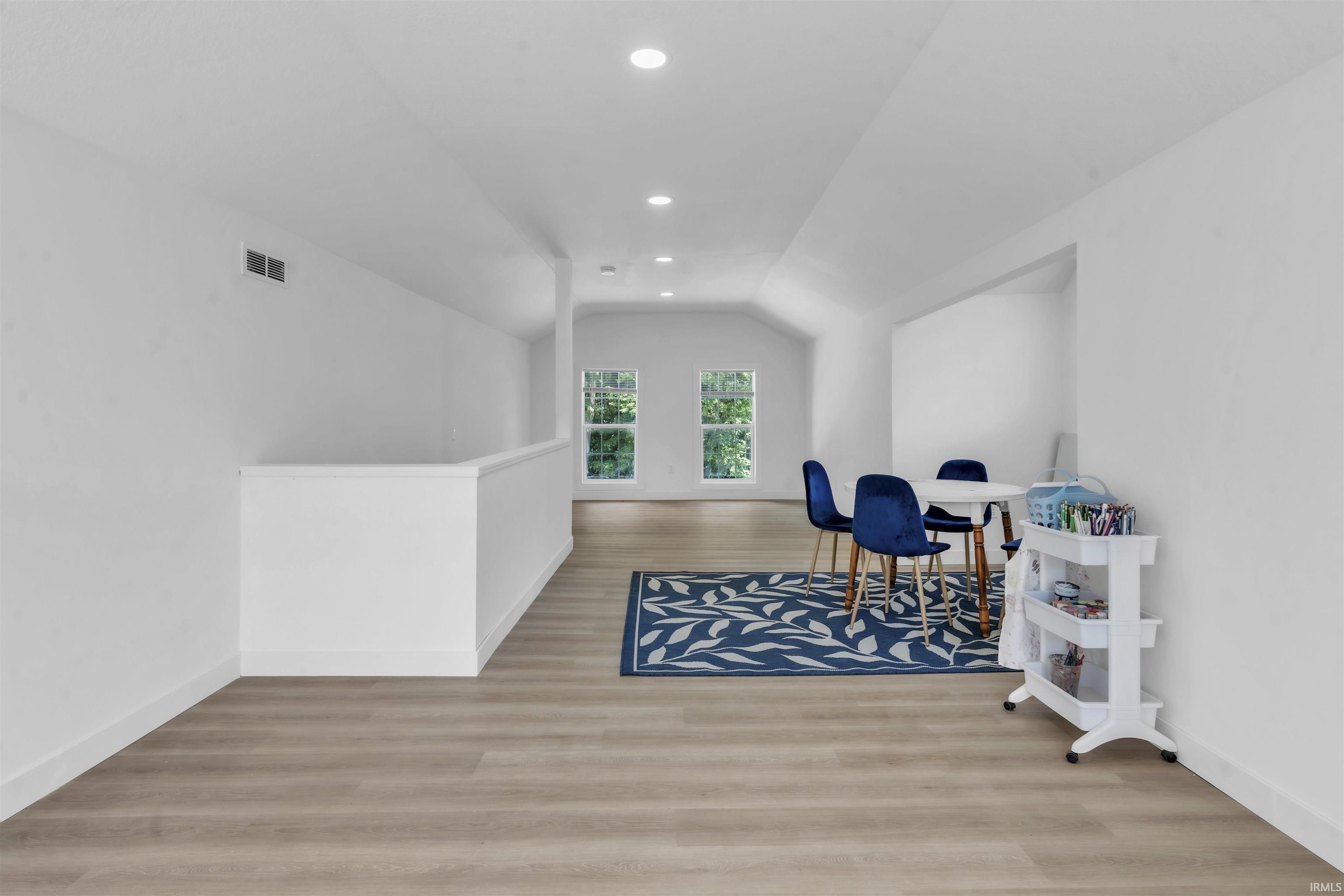Unfurnished room featuring light wood-type flooring and recessed lighting