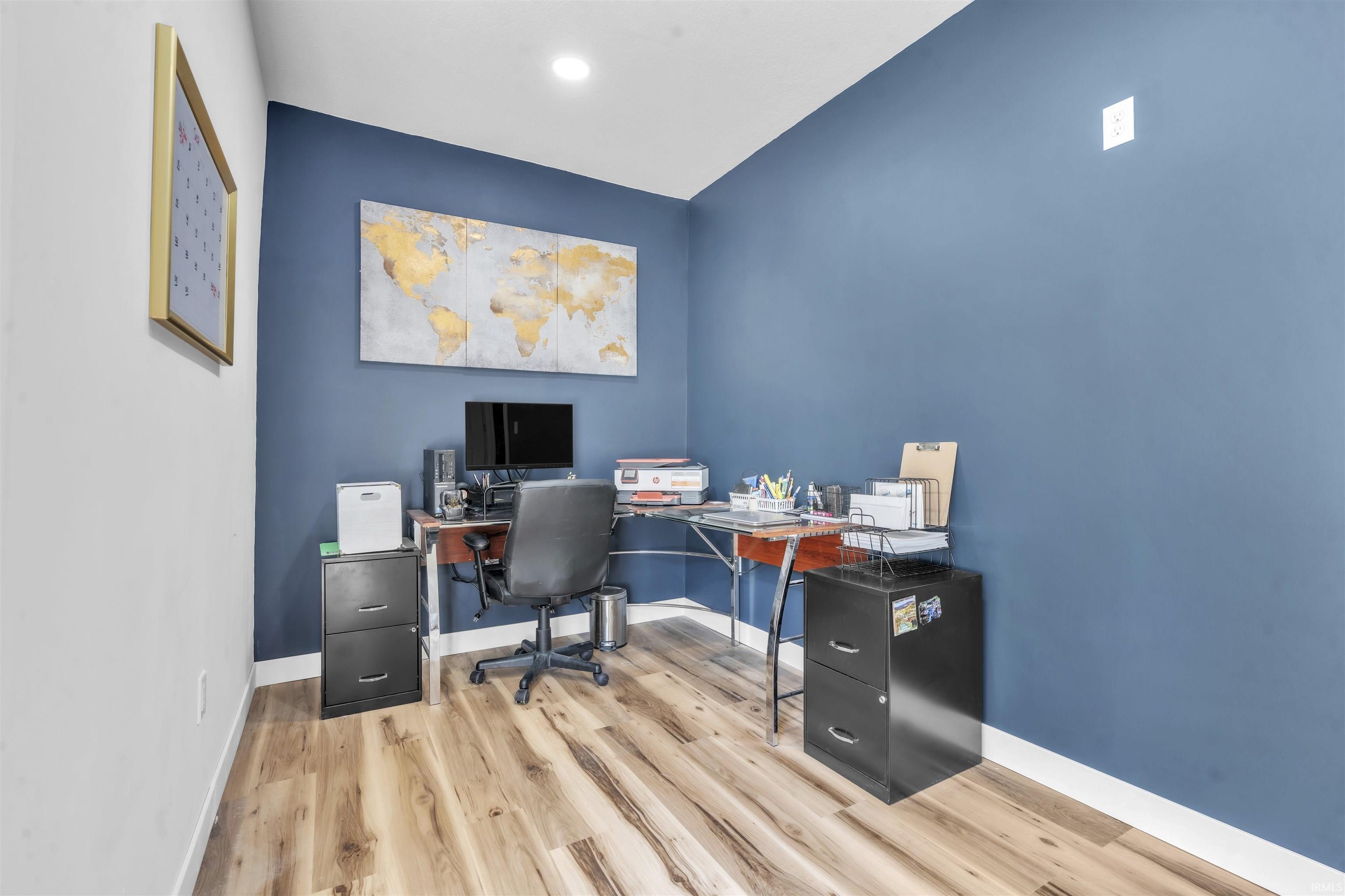 Office area featuring light wood-type flooring and baseboards