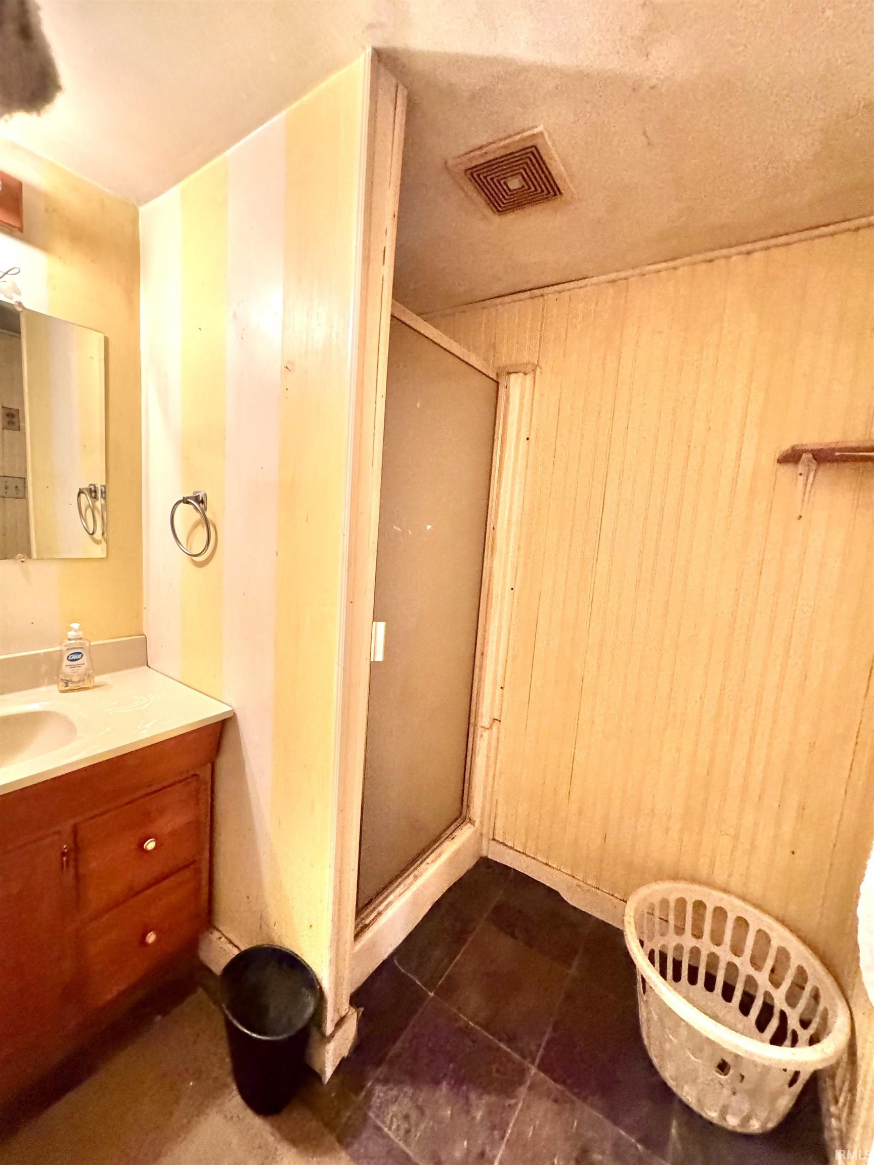 Bathroom with a shower stall, vanity, and a textured ceiling
