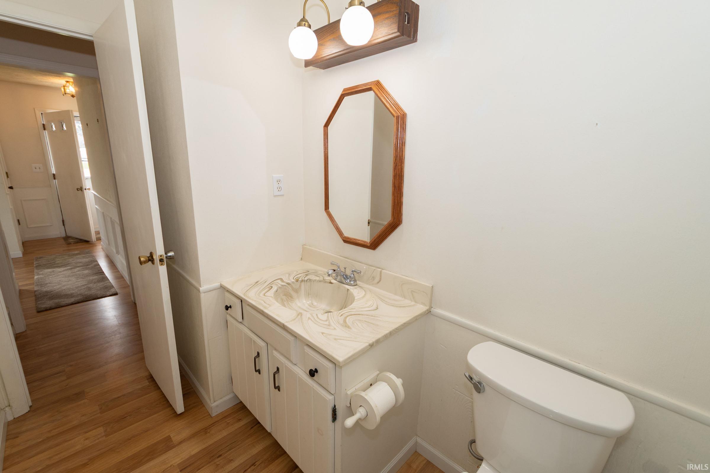 Bathroom with vanity and light wood-style floors