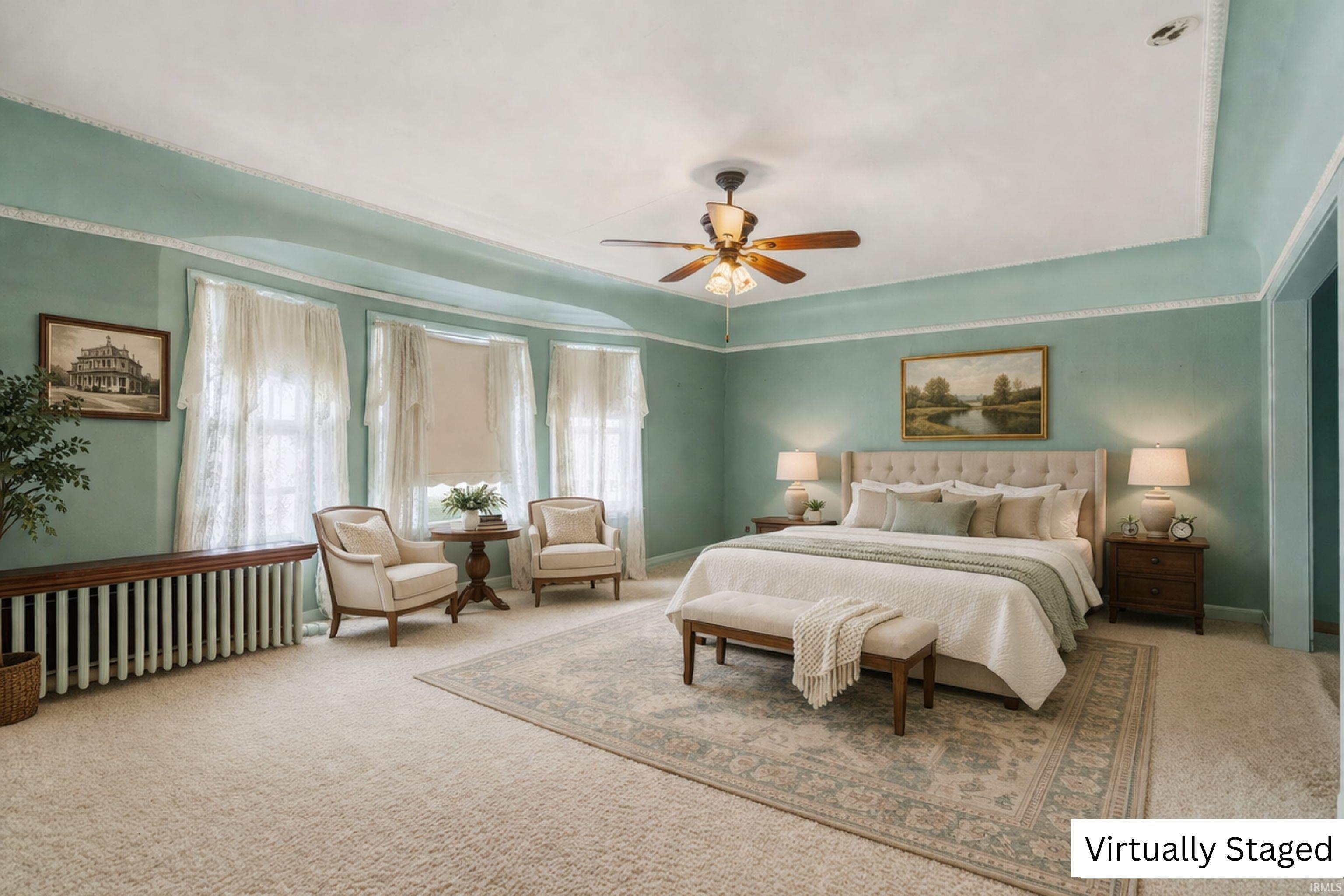 Bedroom featuring carpet, radiator heating unit, and a ceiling fan