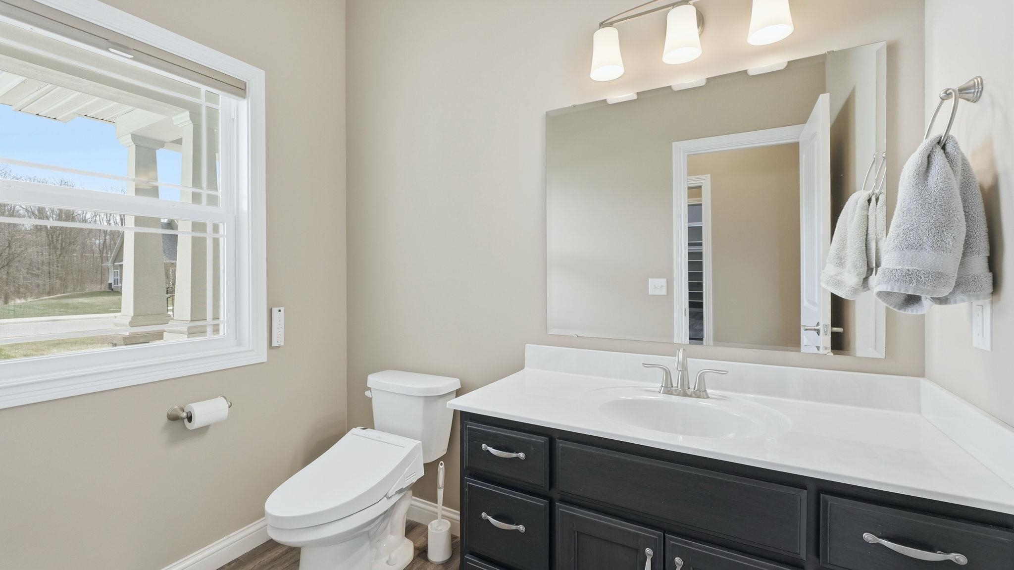 Half bath with toilet and vanity