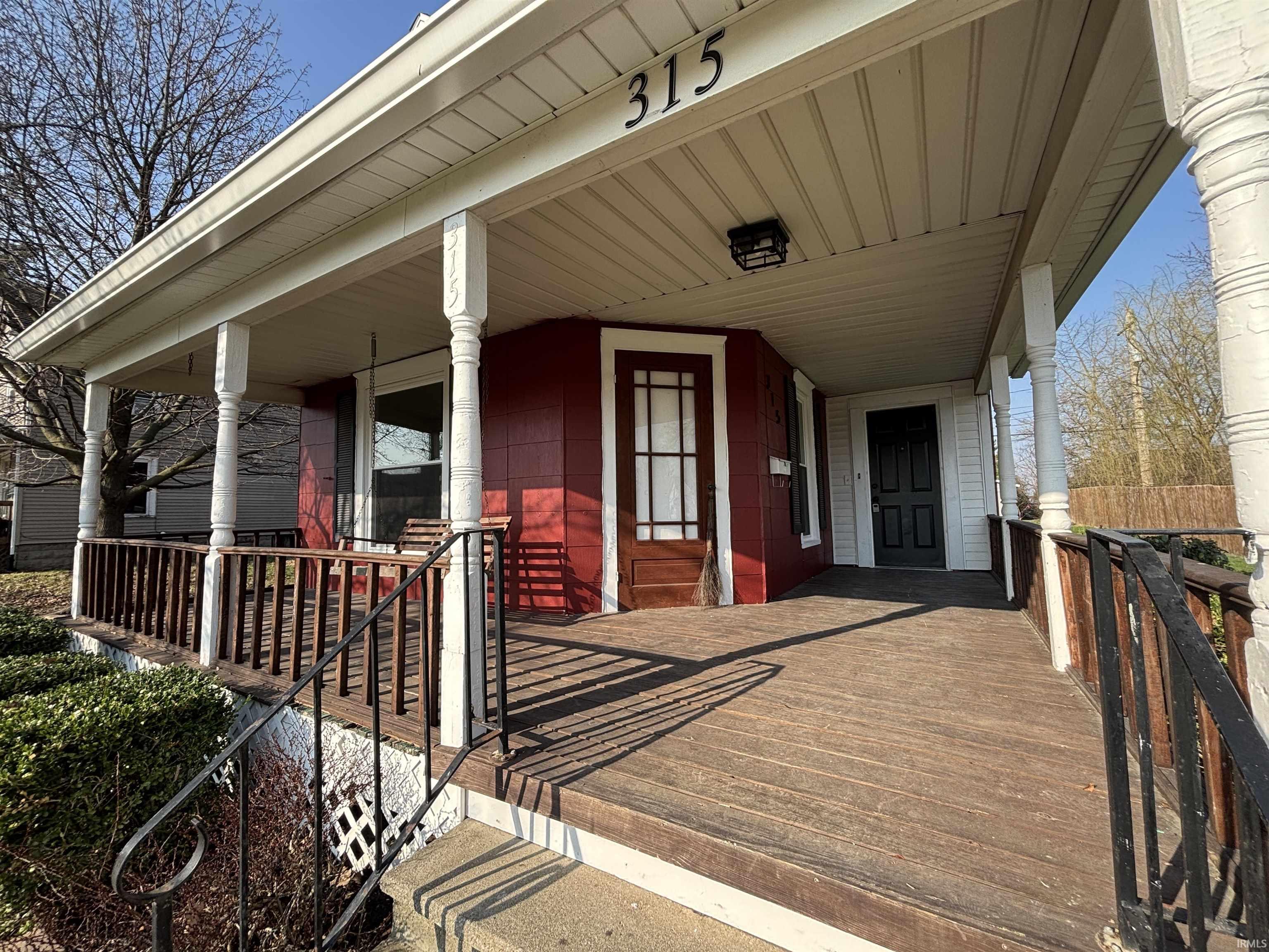 View of exterior entry featuring a porch