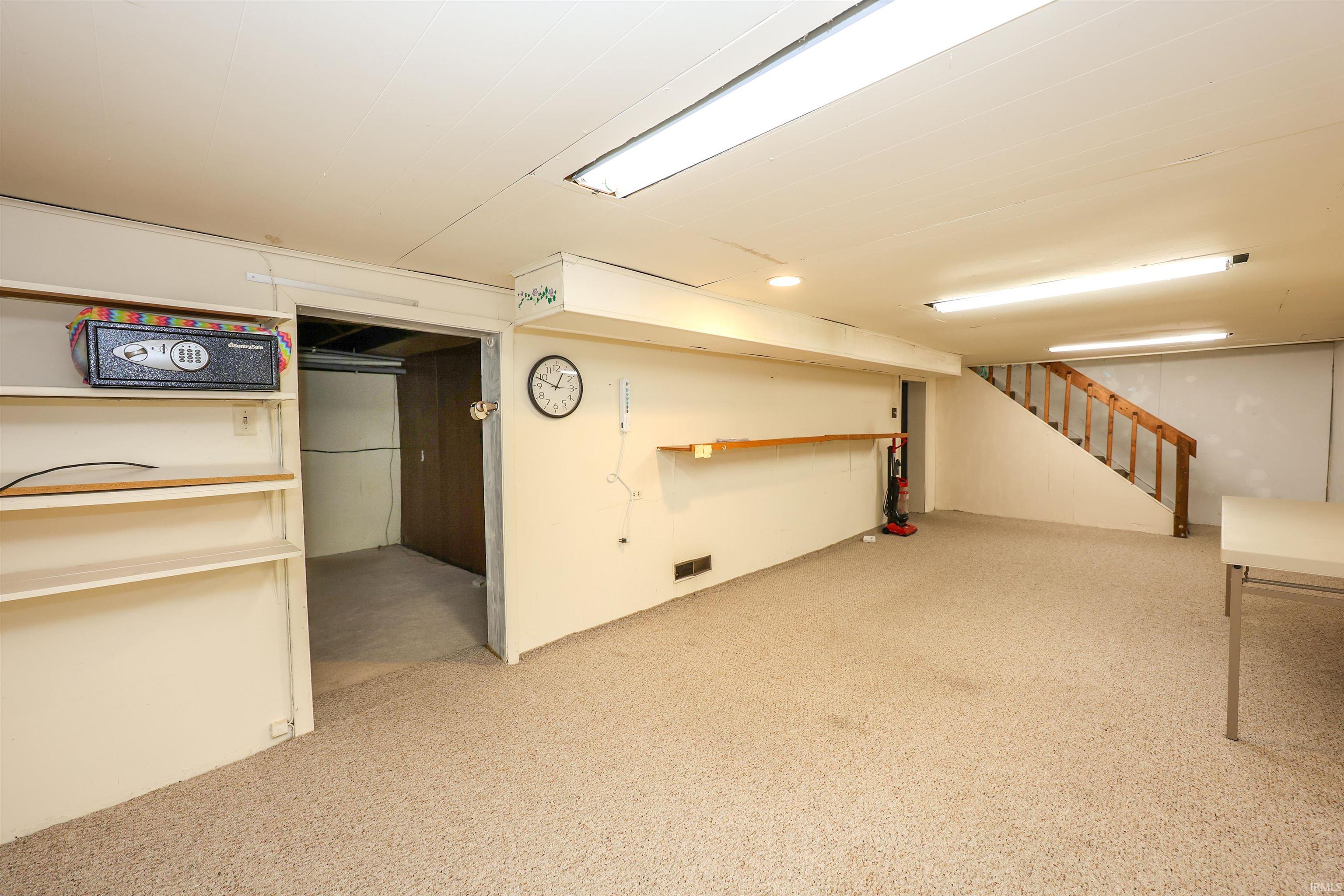 Finished below grade area featuring stairs