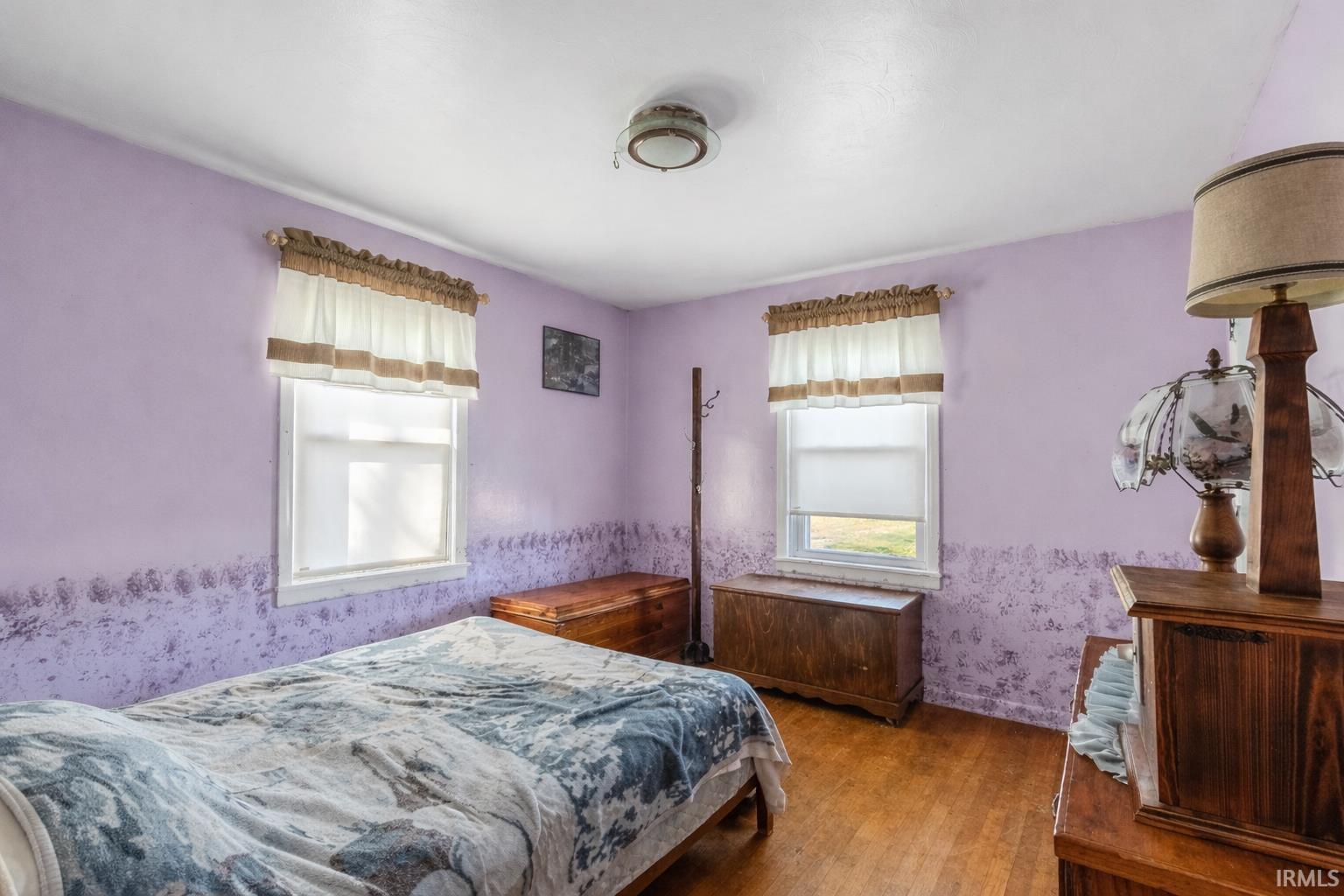 Bedroom with dark wood finished floors