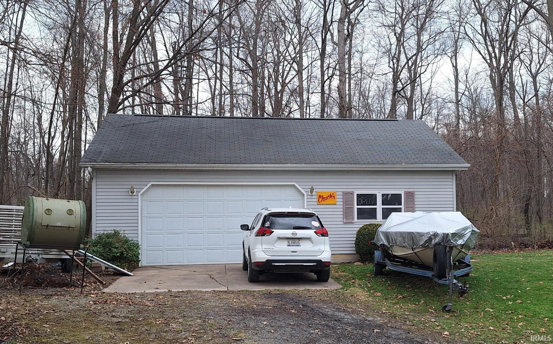 Garage featuring driveway