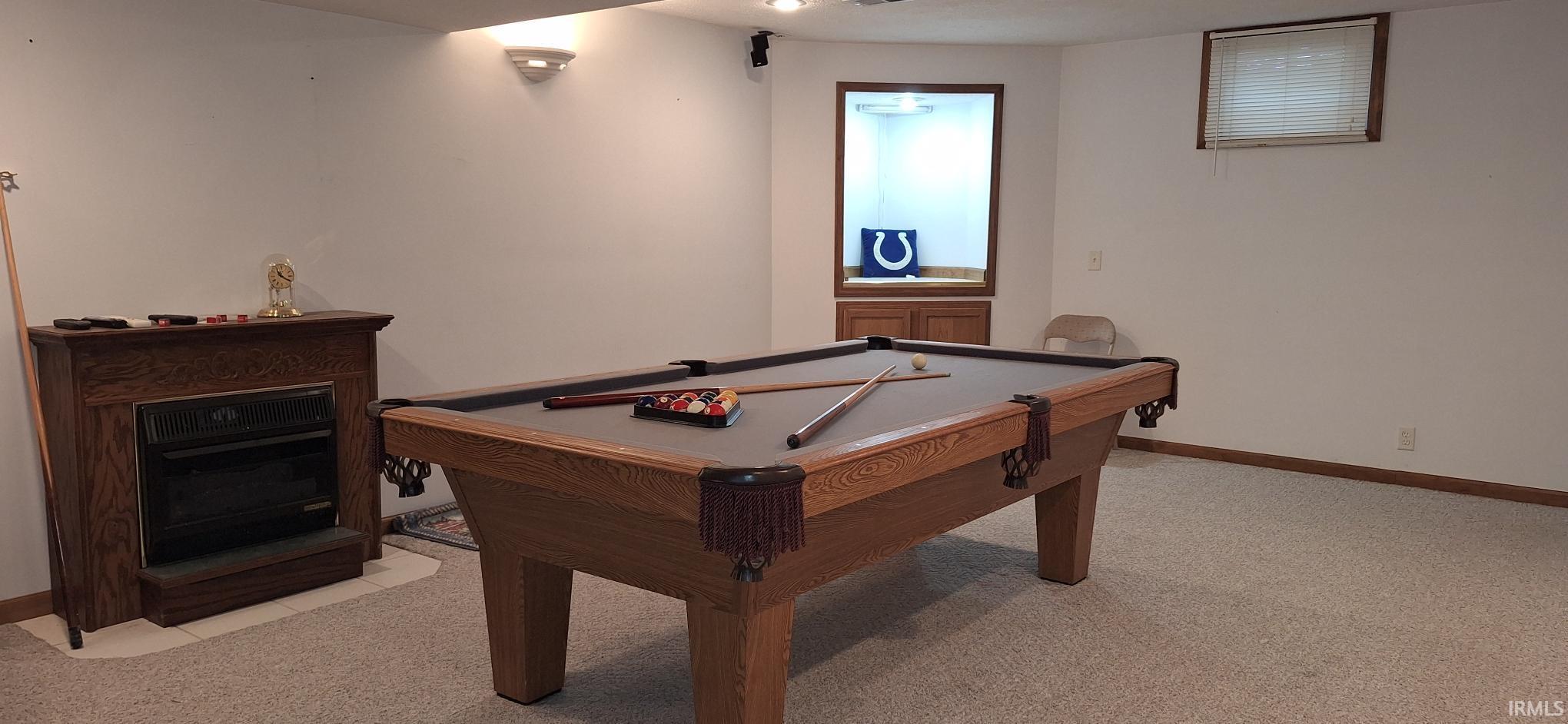 Recreation room featuring light carpet and billiards