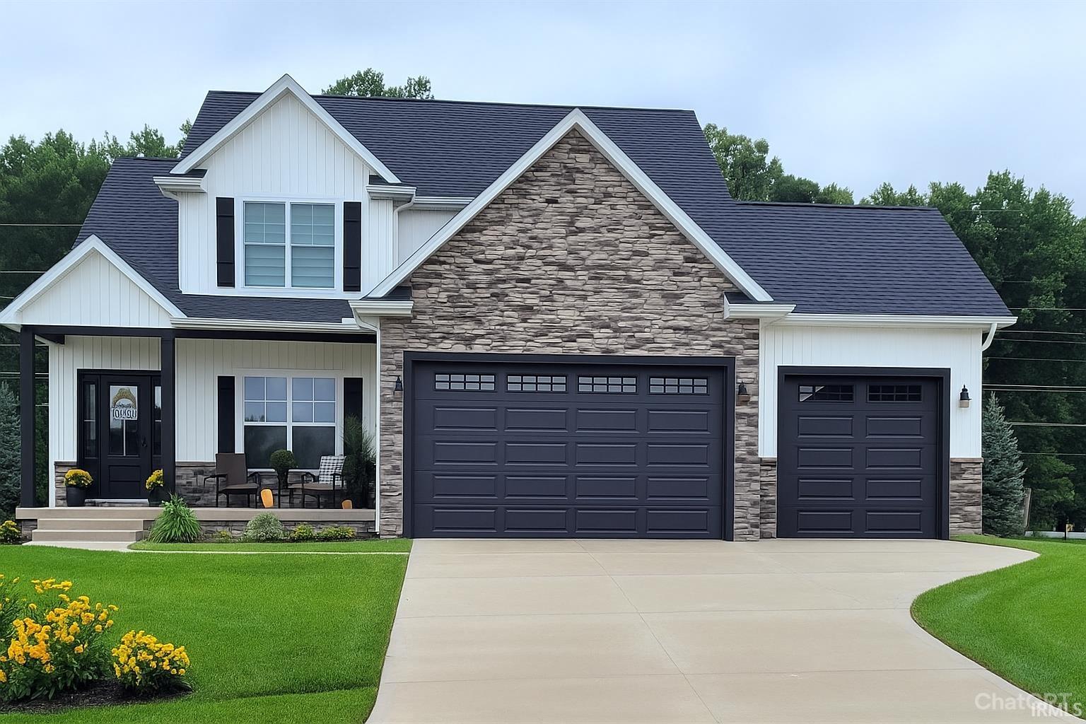 View of front of home with a porch, stone siding, and a front lawn