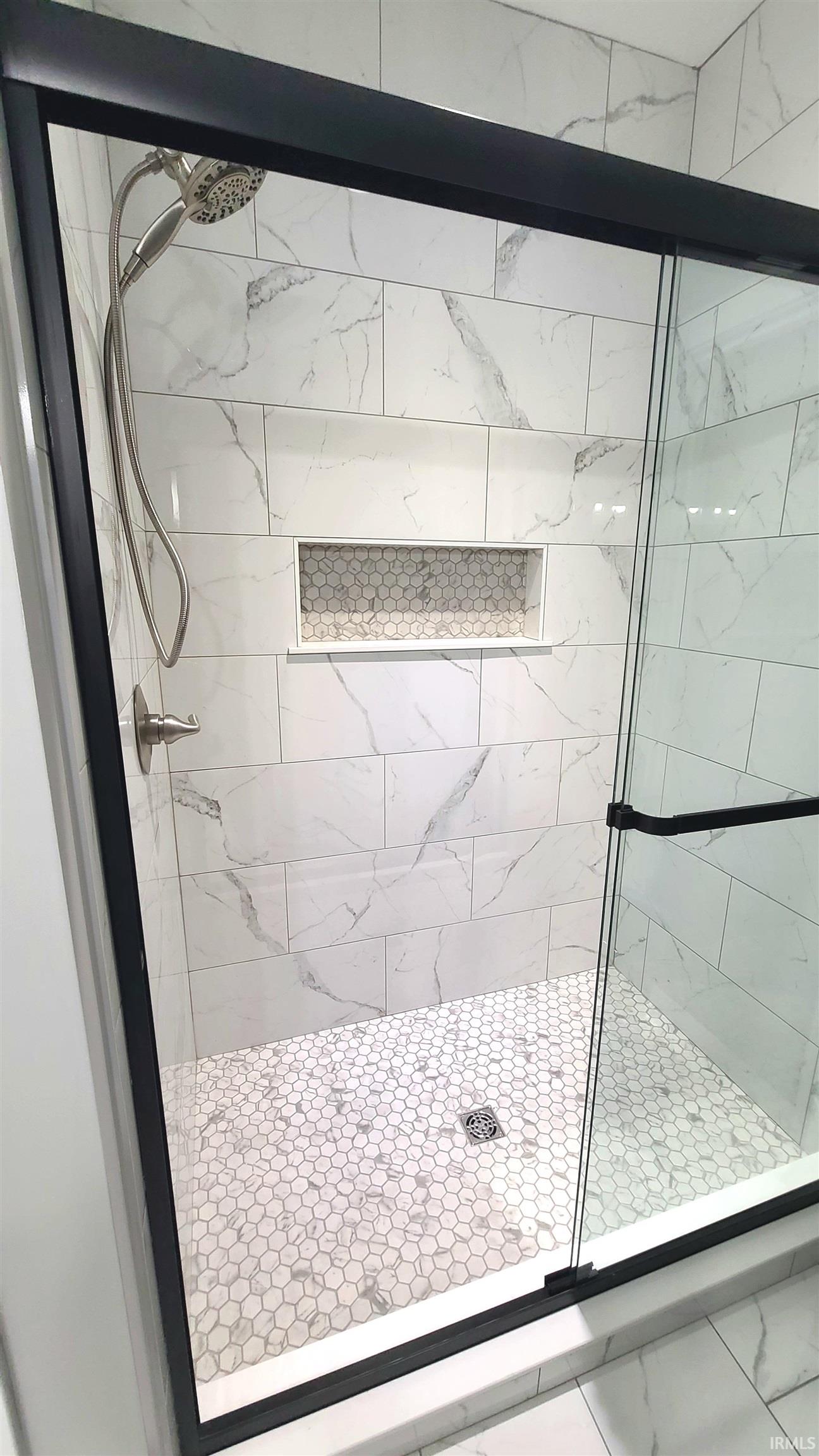 Bathroom featuring a shower stall