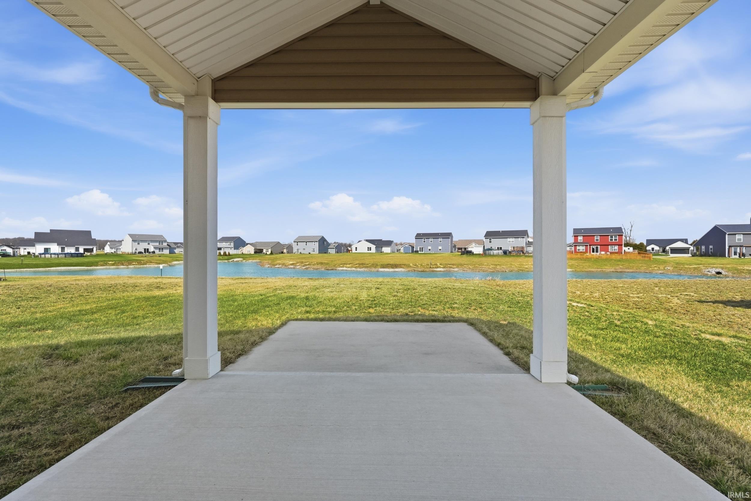 View of patio featuring a residential view and a water view