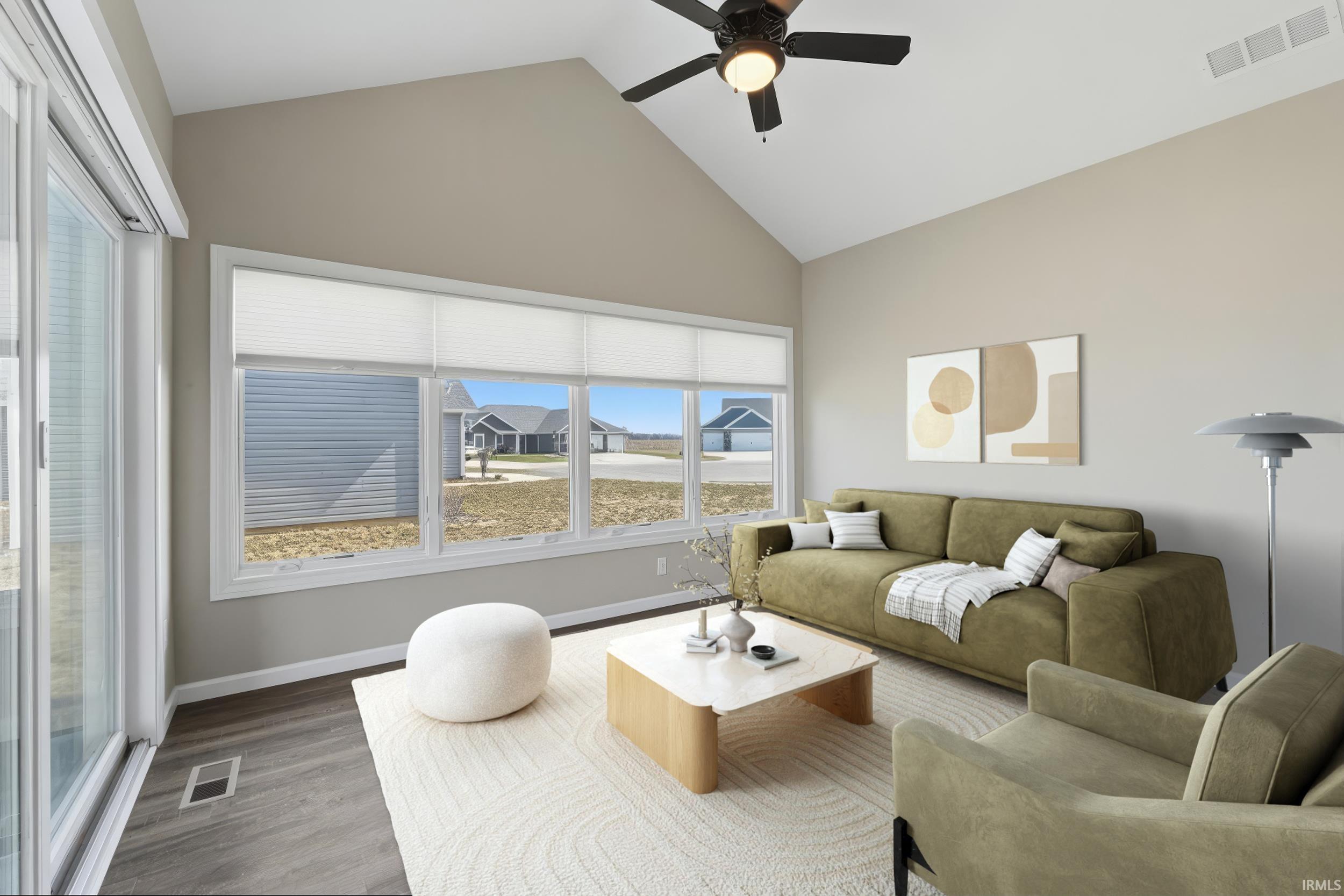 Living room with ceiling fan and wood finished floors