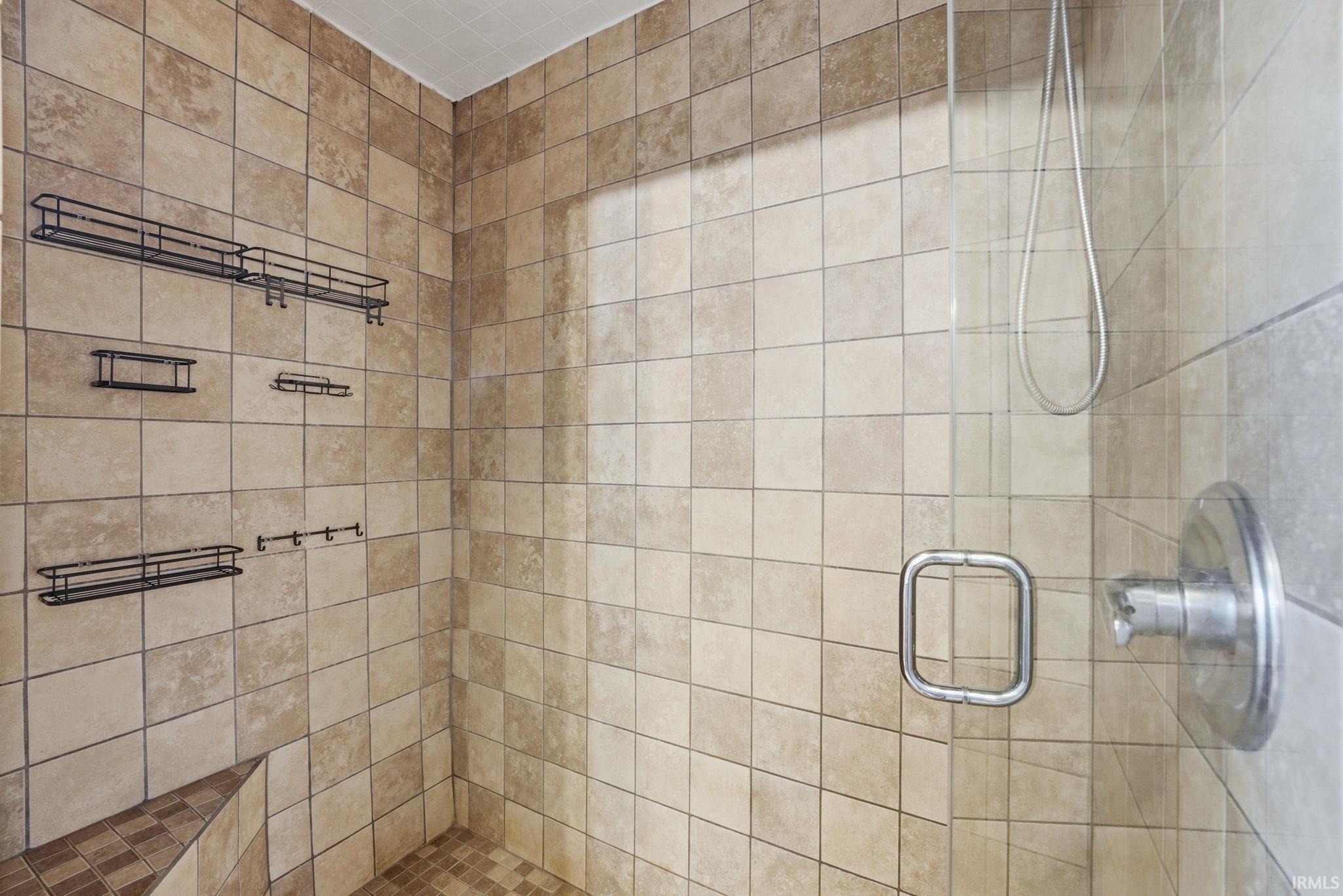 Full bathroom with a shower stall