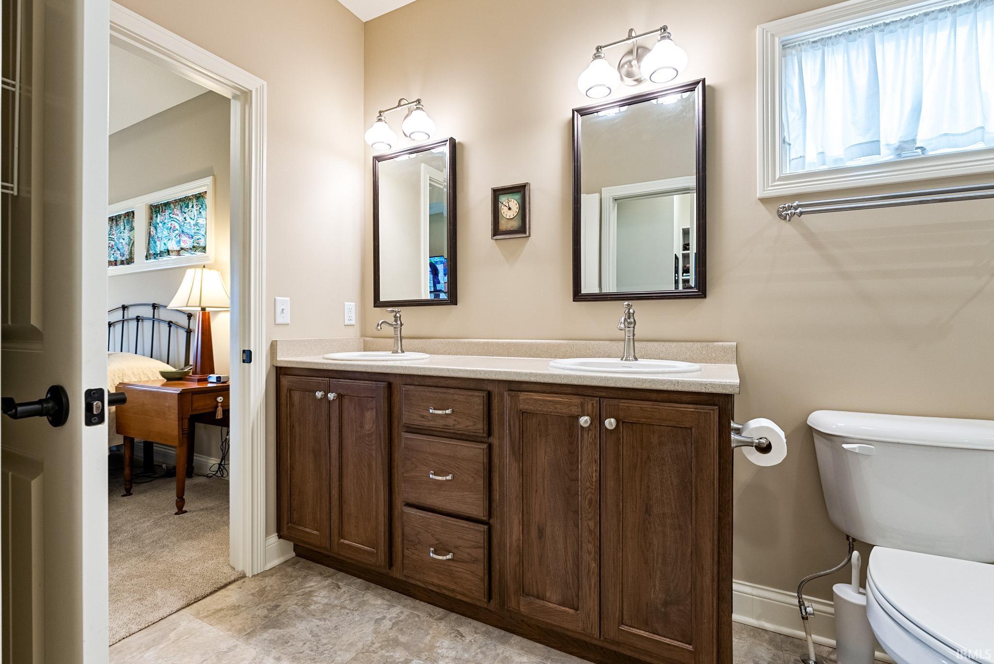 Bathroom with double vanity and ensuite bath
