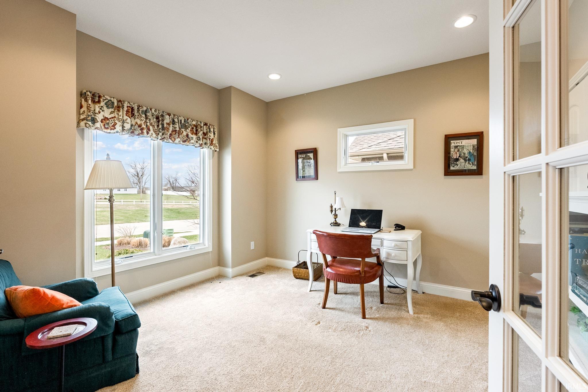 Office featuring plenty of natural light, light colored carpet, recessed lighting, and french doors