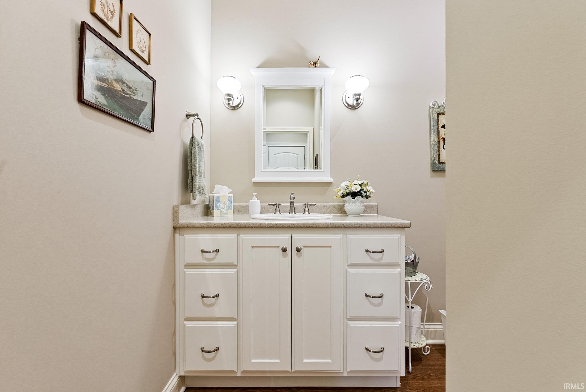 Bathroom with vanity and dark wood-type flooring