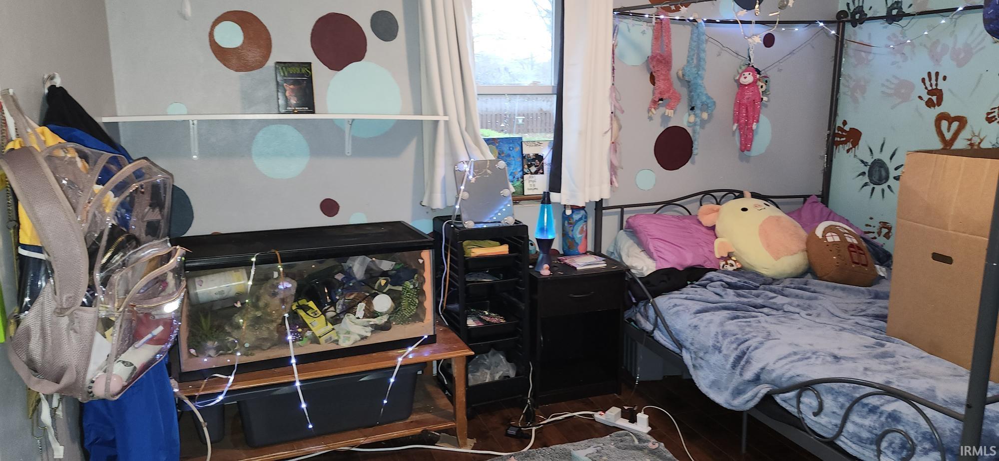Bedroom featuring wood finished floors