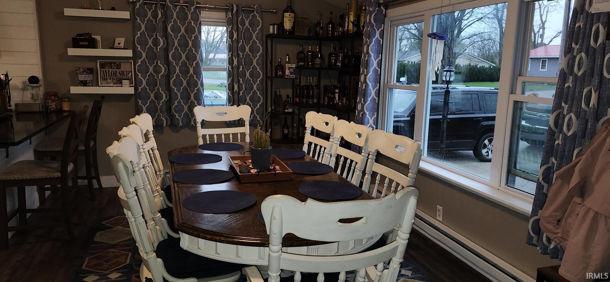 Dining space with a baseboard heating unit and baseboards