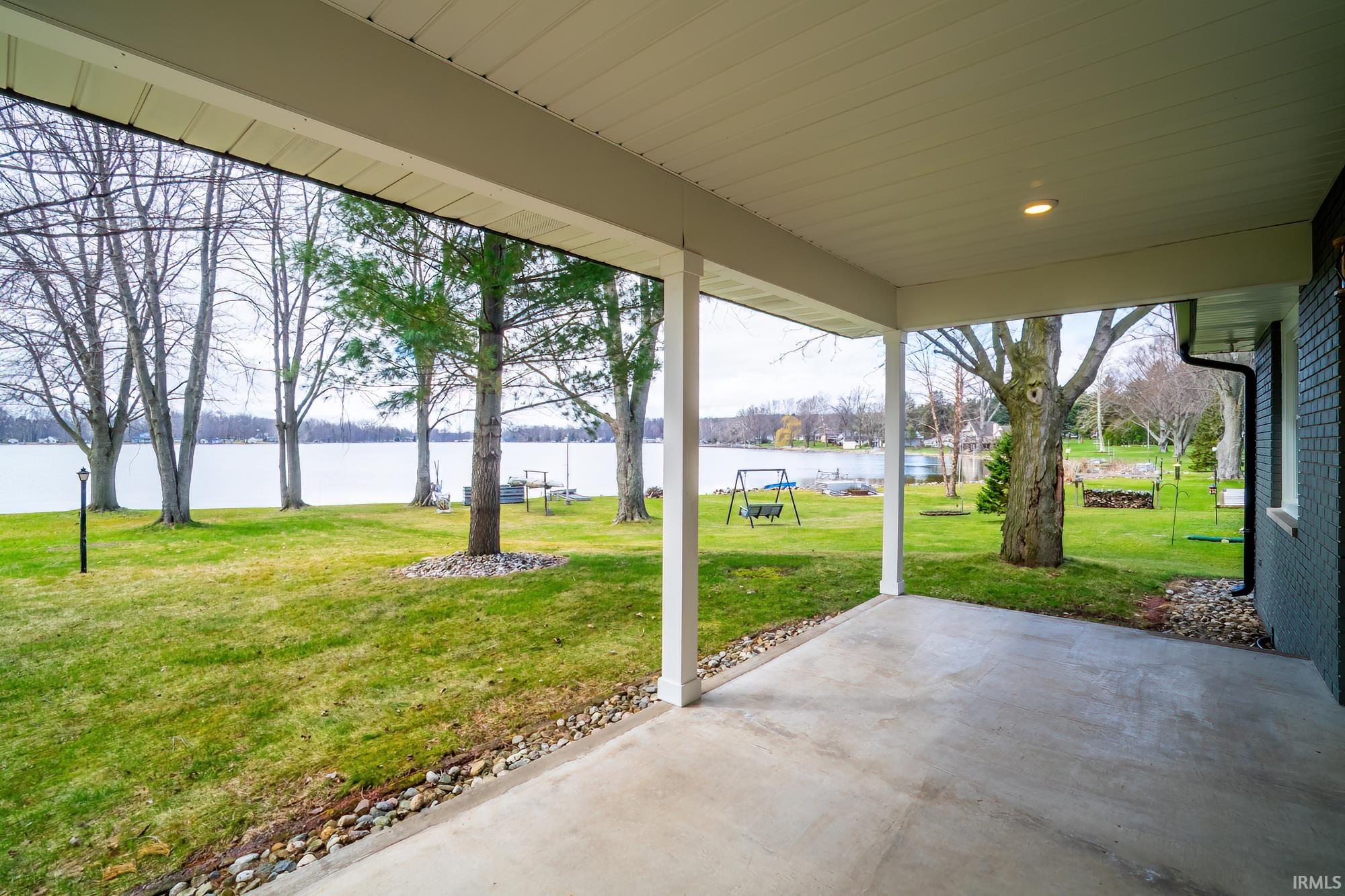 View of patio with a water view