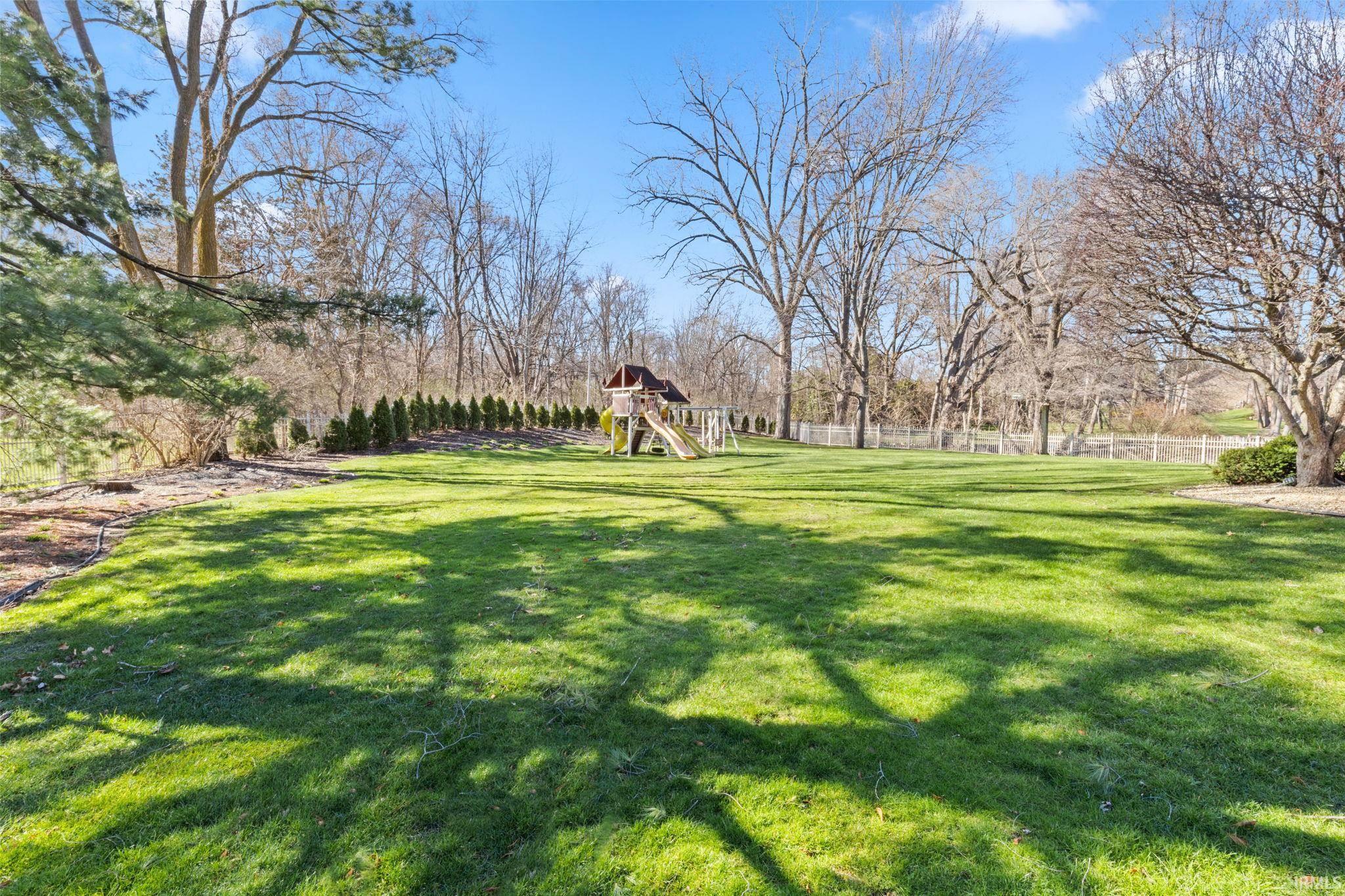 View of yard featuring a playground