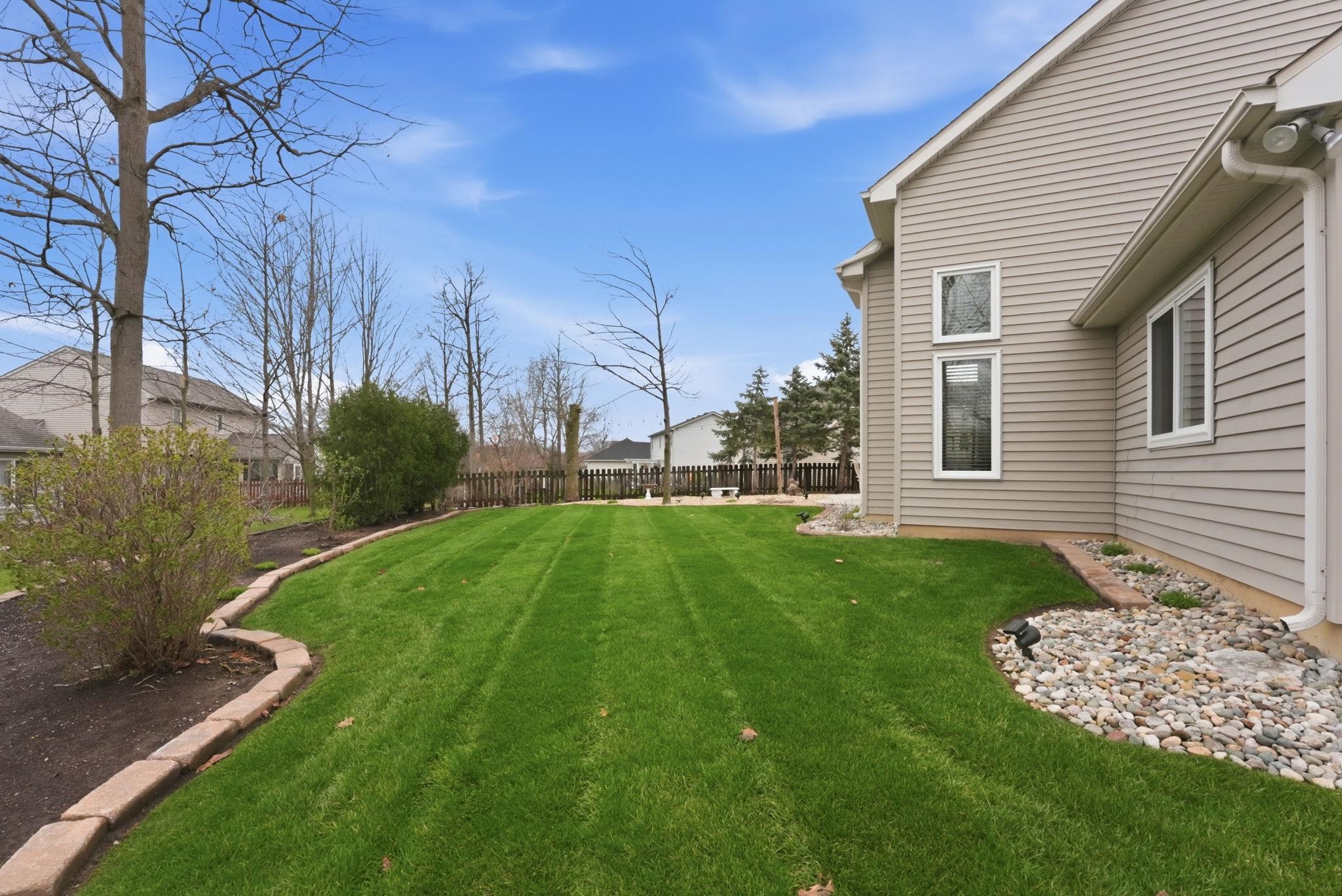 View of fenced backyard