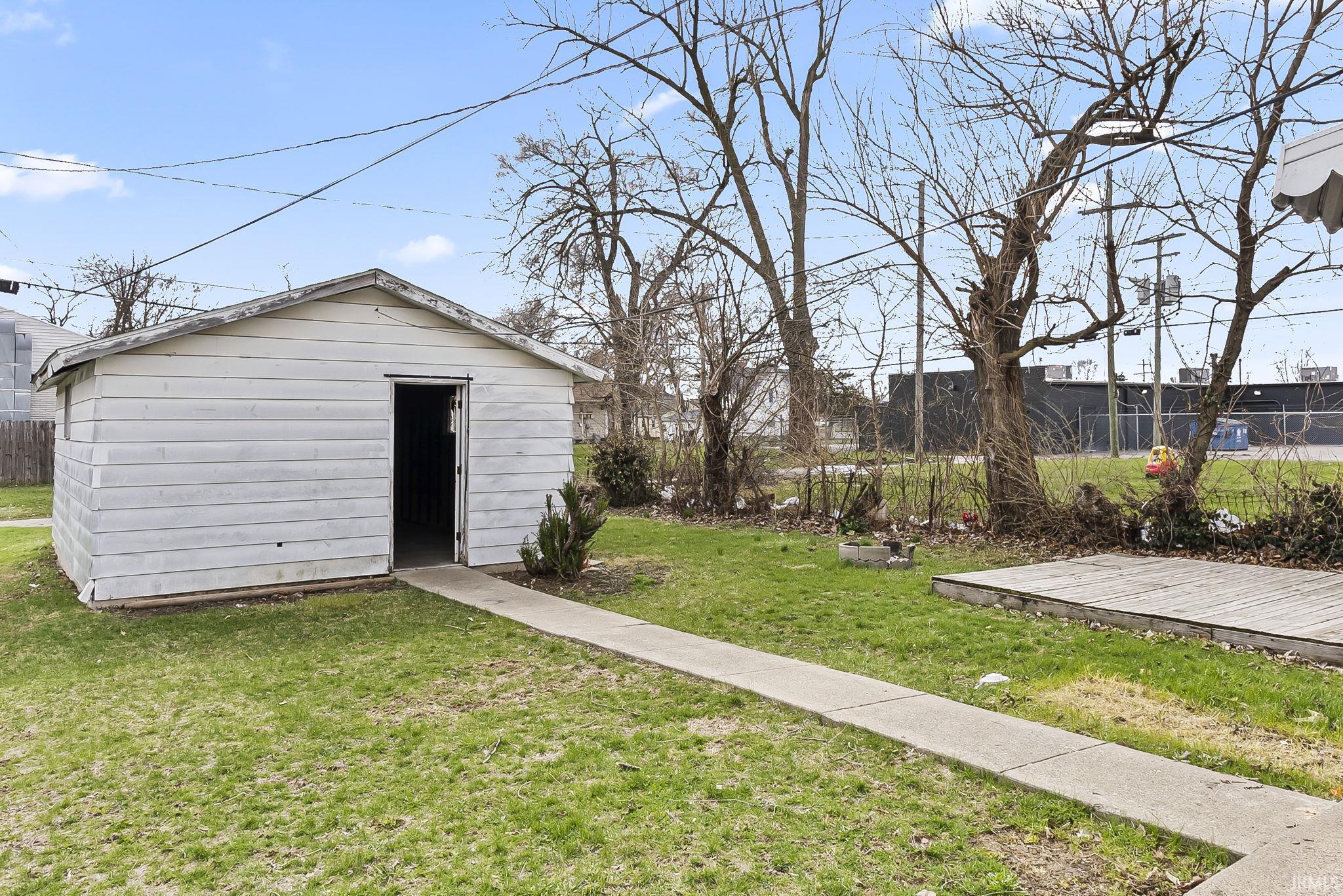 View of yard featuring a storage unit