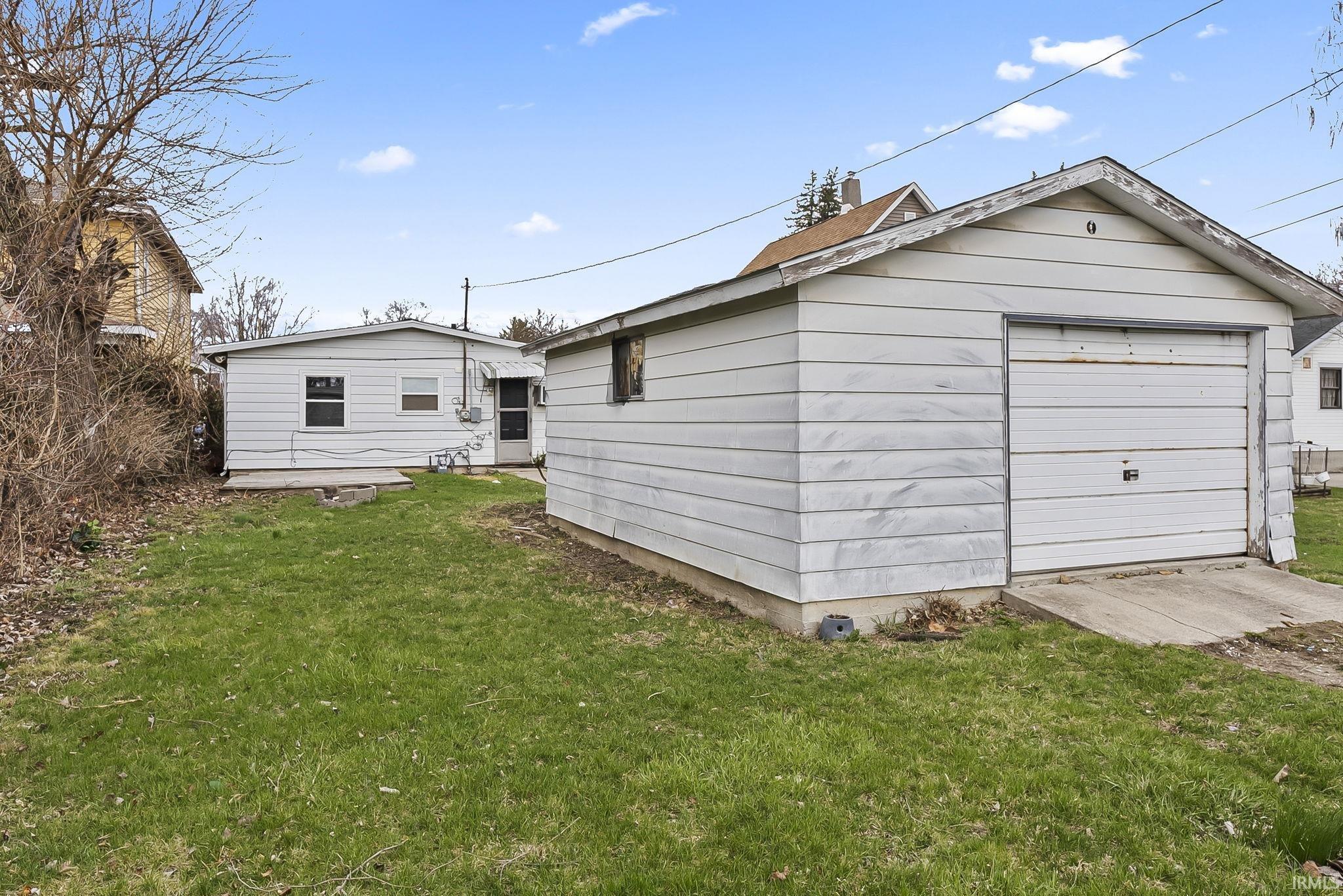 Detached garage featuring driveway