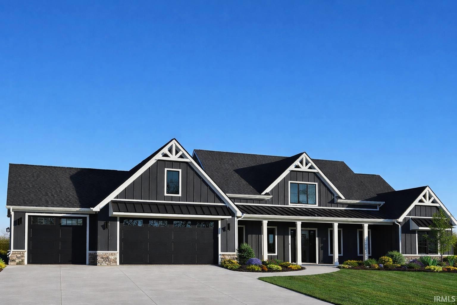 Modern farmhouse style home featuring board and batten siding, covered porch, concrete driveway, a shingled roof, and an attached garage. AI used to show front fully painted, concrete driveway and landscaping
