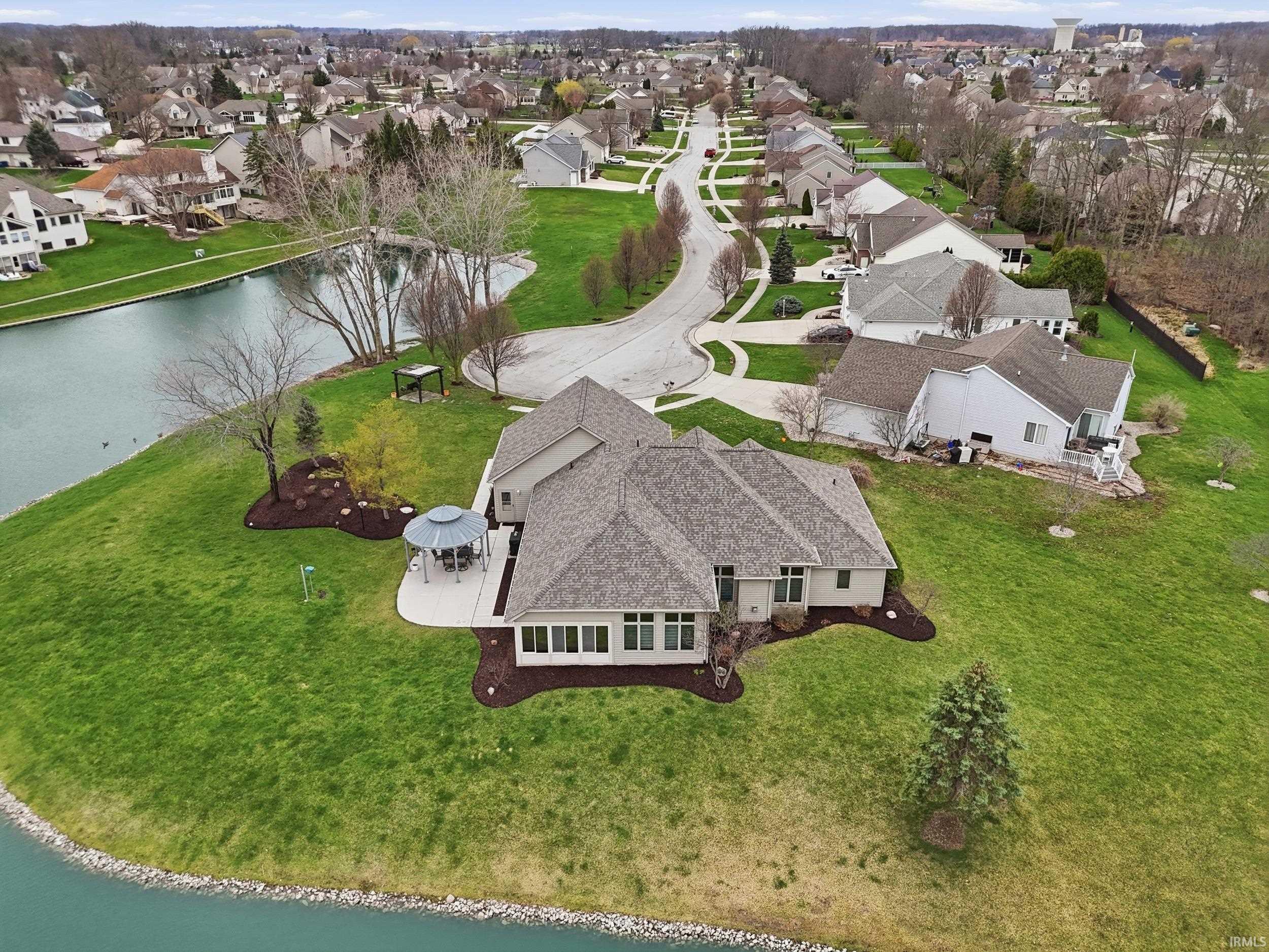 Aerial perspective of suburban area with a nearby body of water