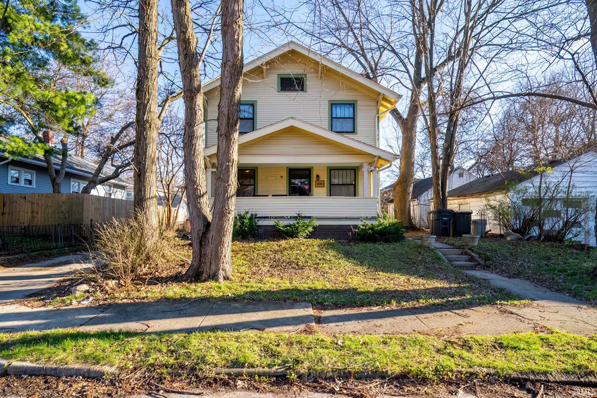 American foursquare style home with a porch