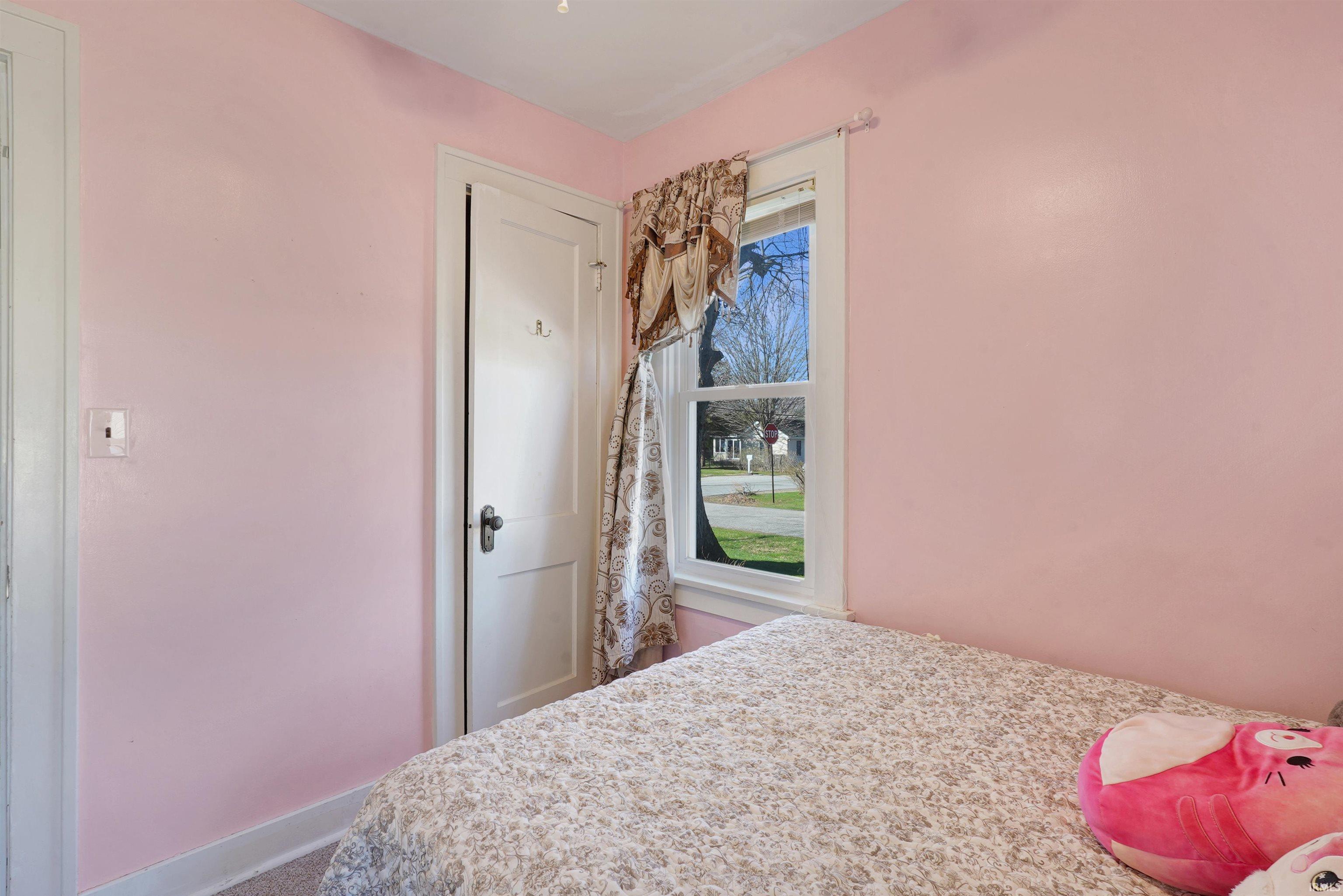 Bedroom featuring baseboards