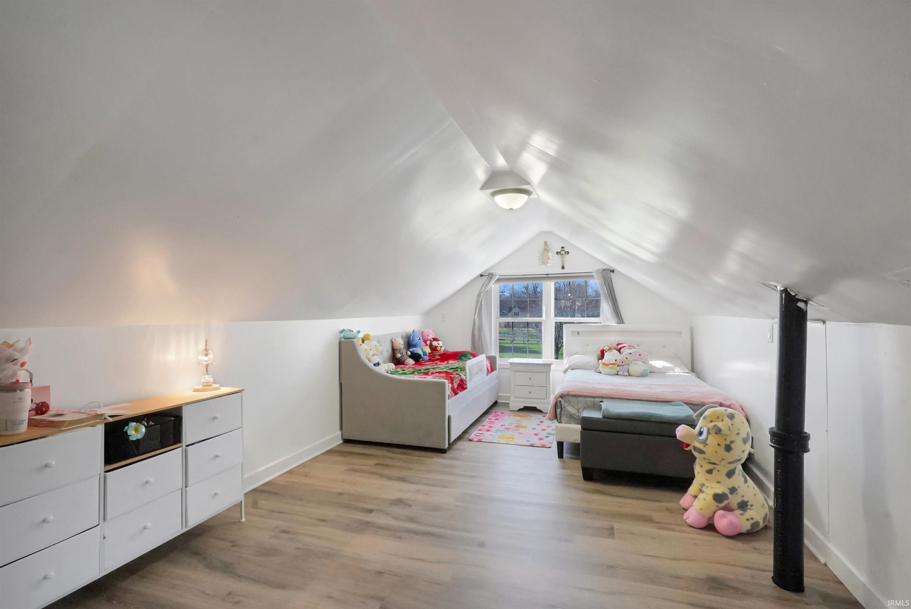 Bedroom with light wood-style flooring