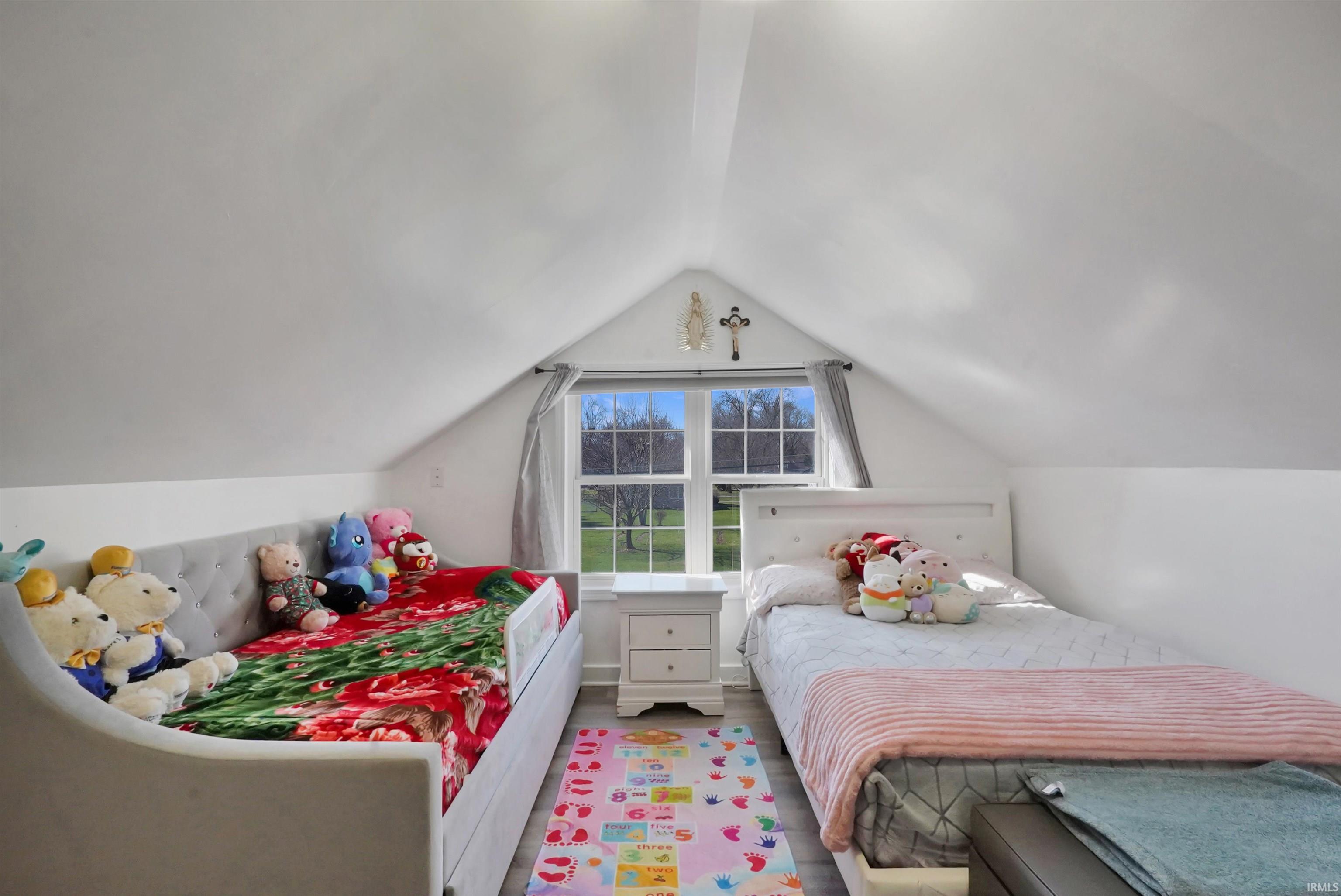 Bedroom with wood finished floors