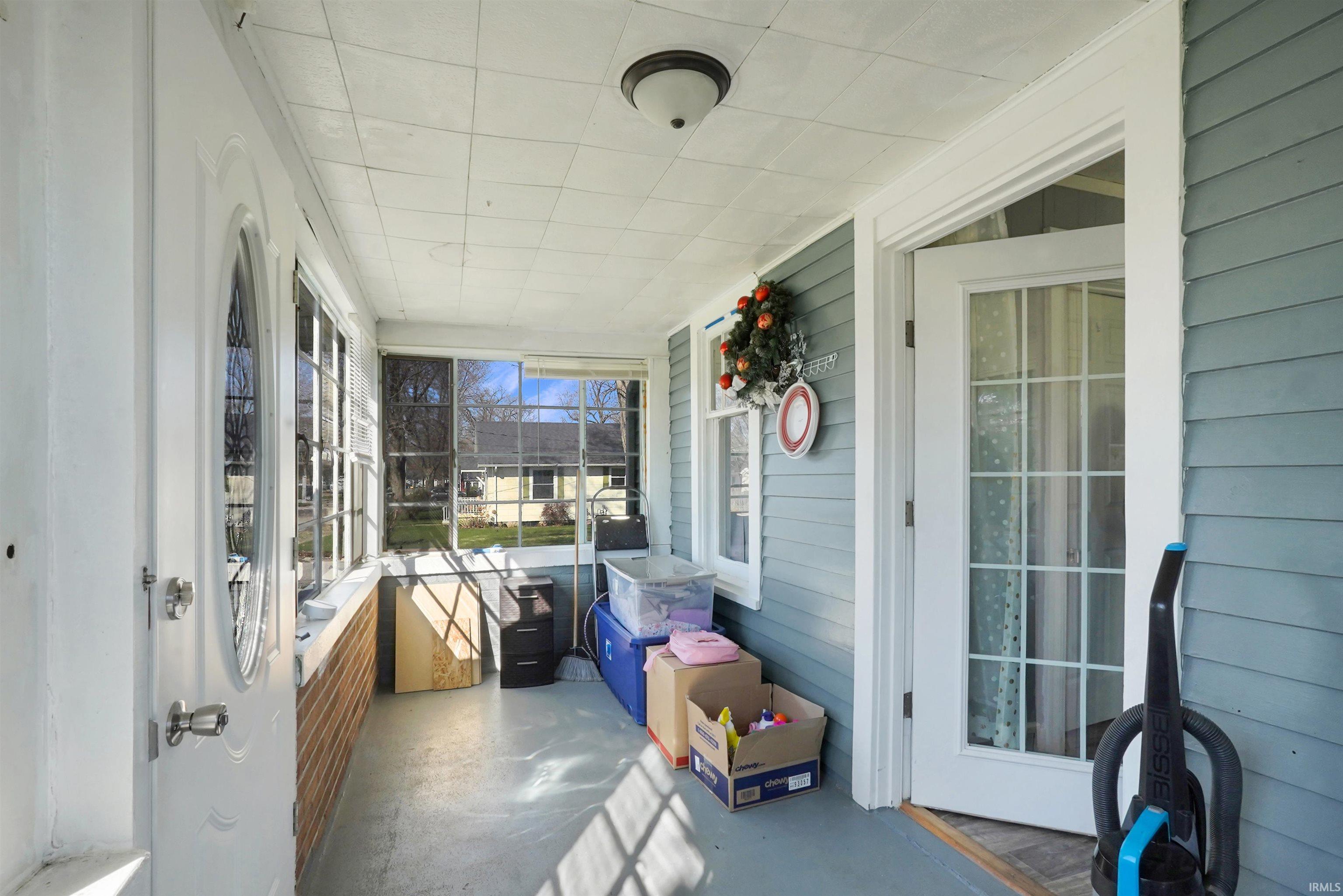 Sunroom with a porch