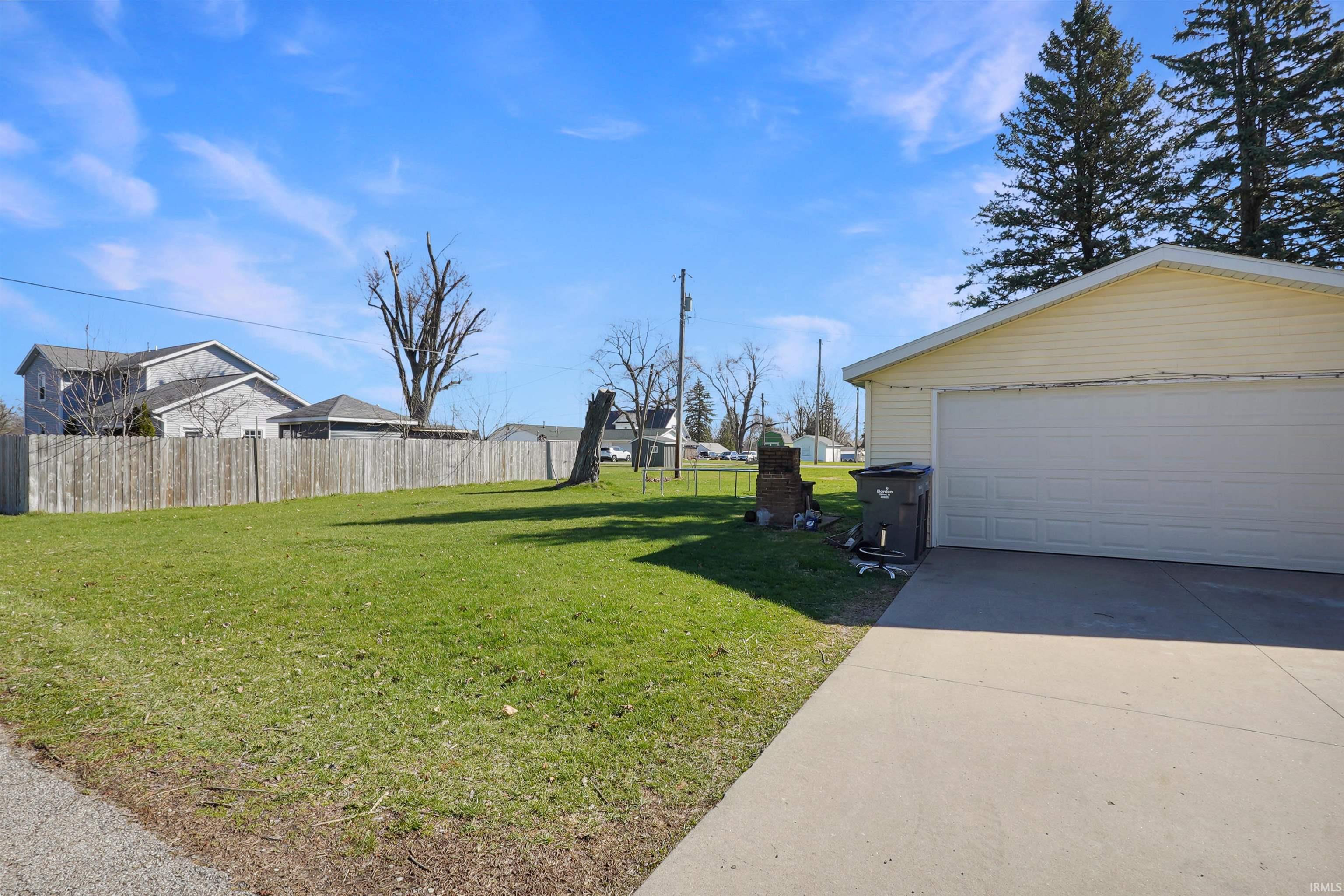 View of yard with a detached garage
