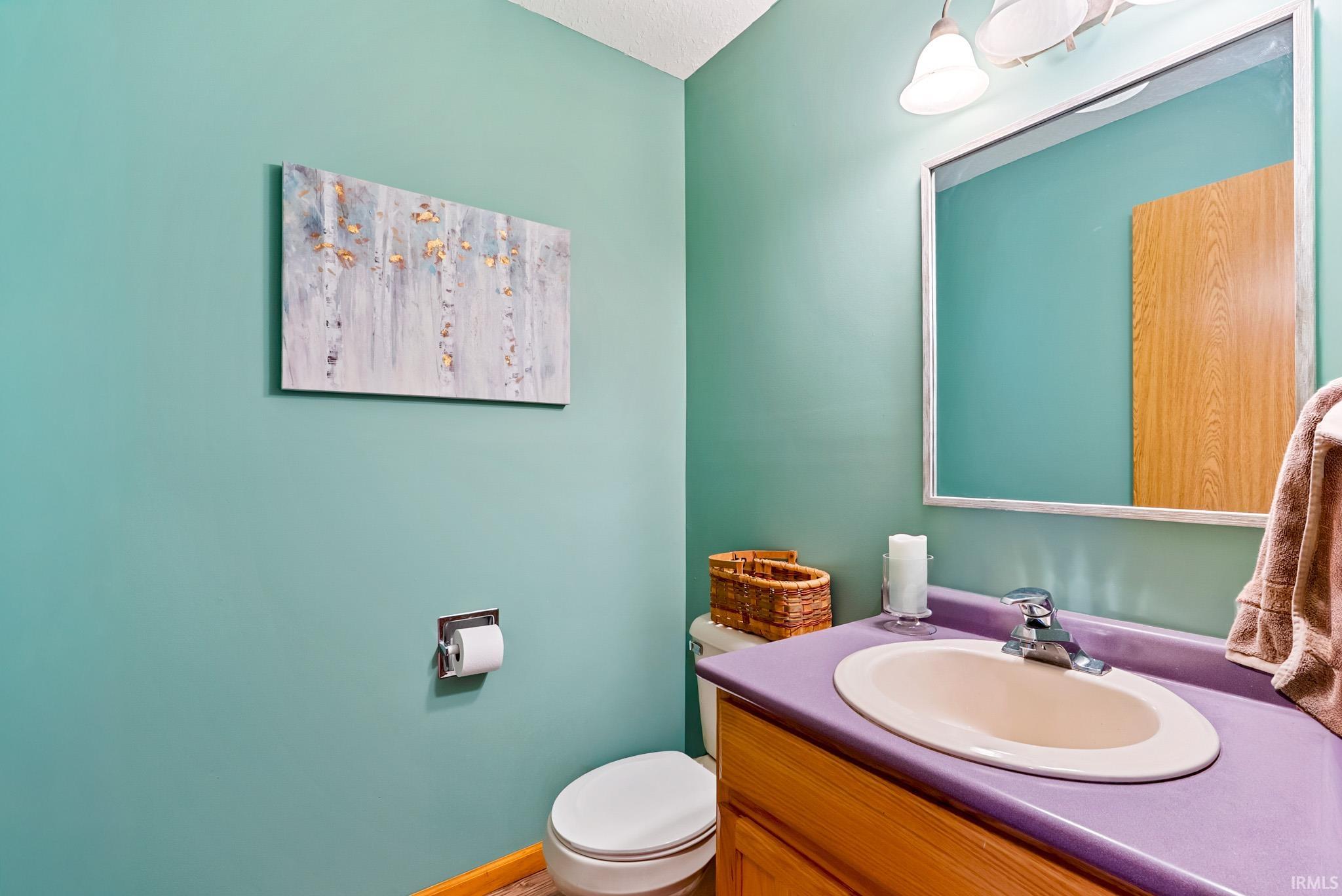 Bathroom with toilet and vanity