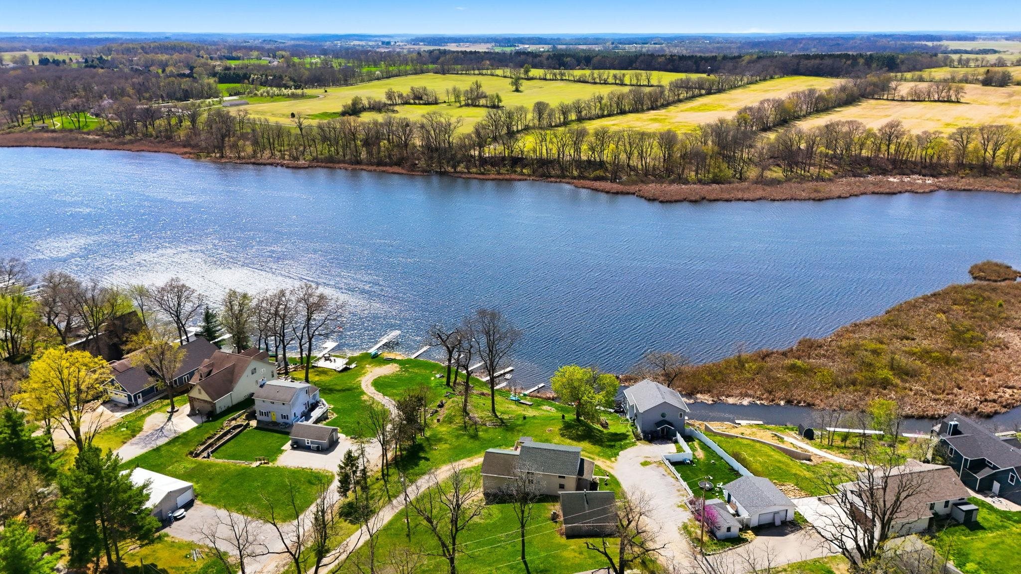 Aerial perspective of suburban area with a nearby body of water