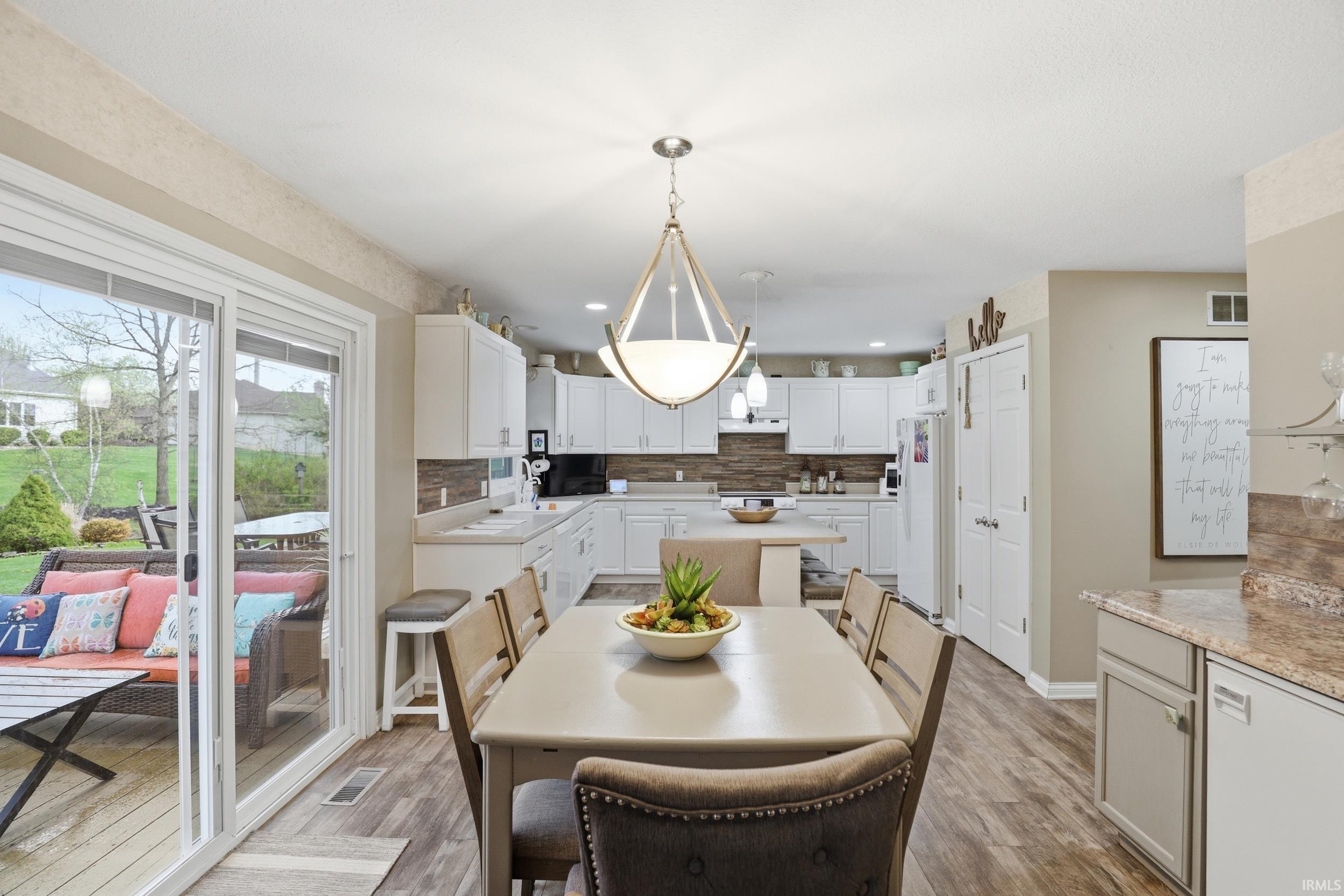 Dining room featuring light wood finished floors and recessed lighting