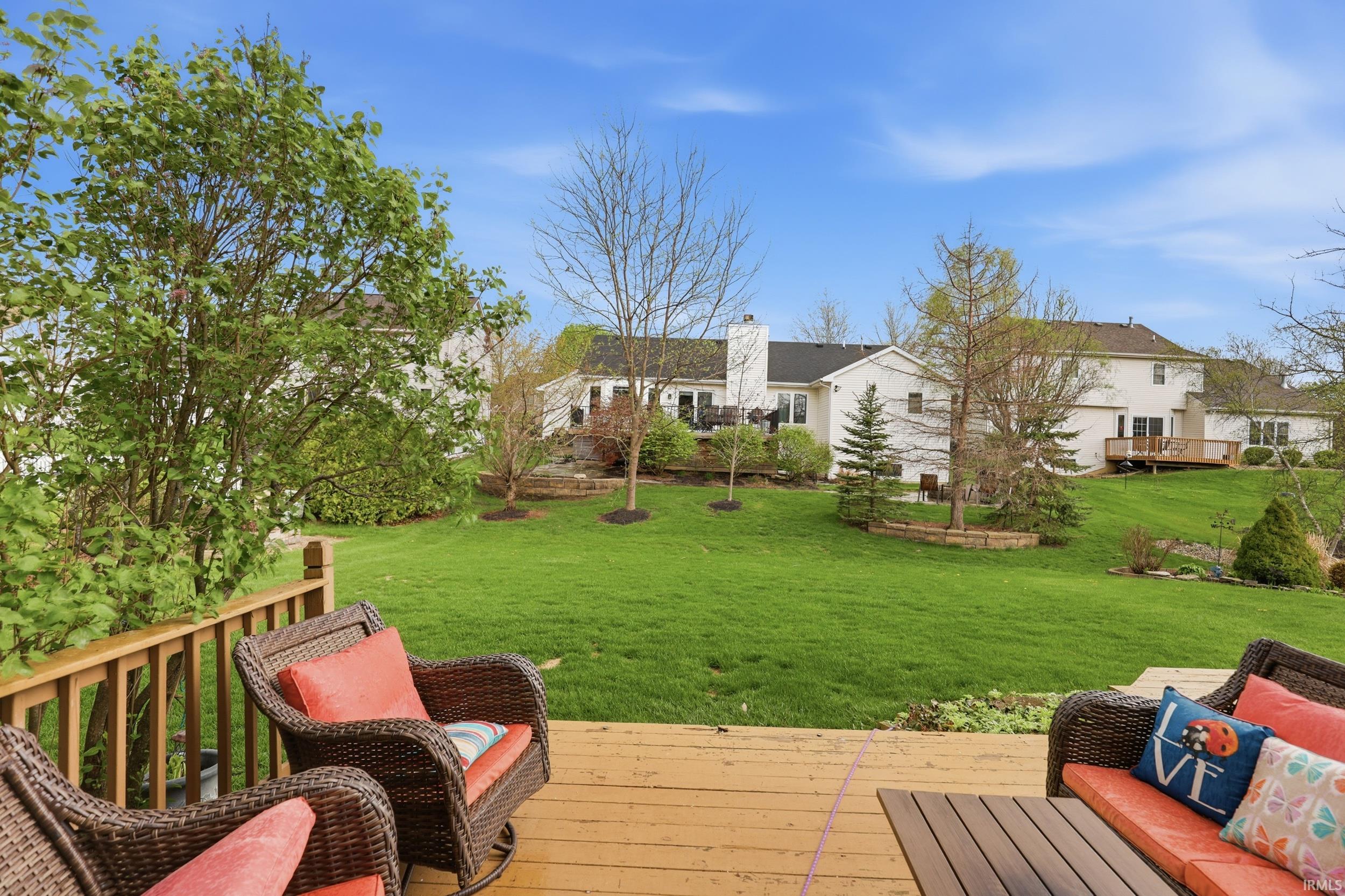 Wooden deck featuring a lawn