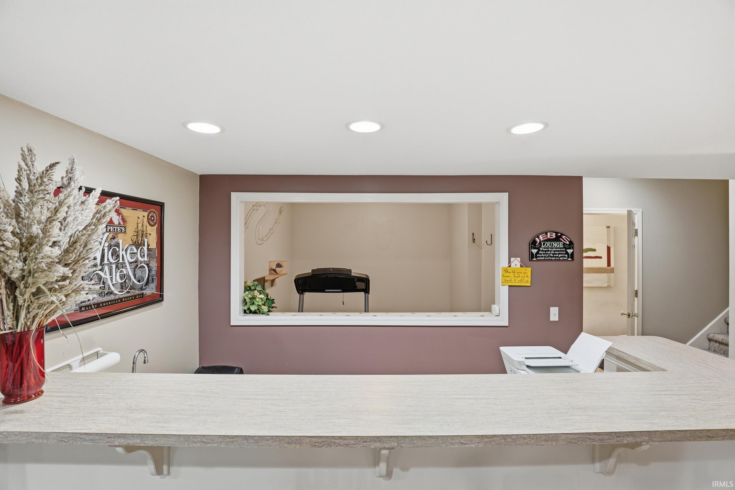 Interior space with vanity and recessed lighting