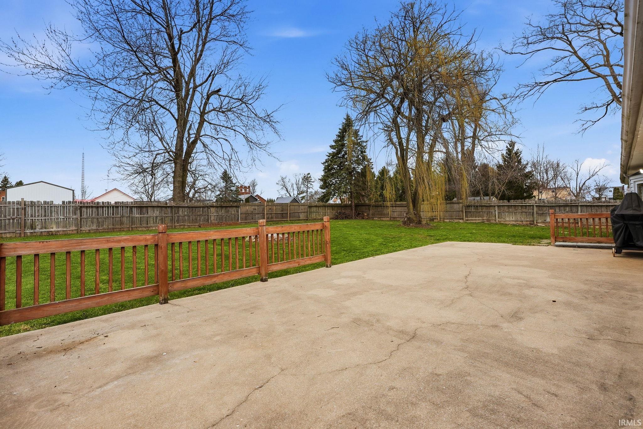 Fenced backyard with a patio area and area for grilling