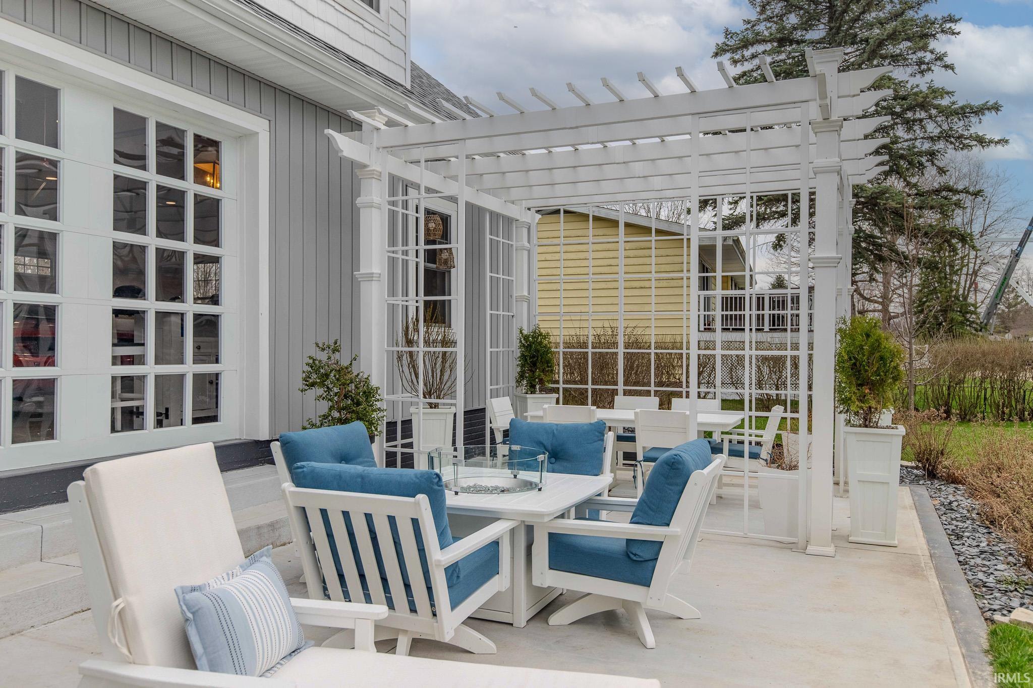 View of patio featuring outdoor lounge area and a pergola