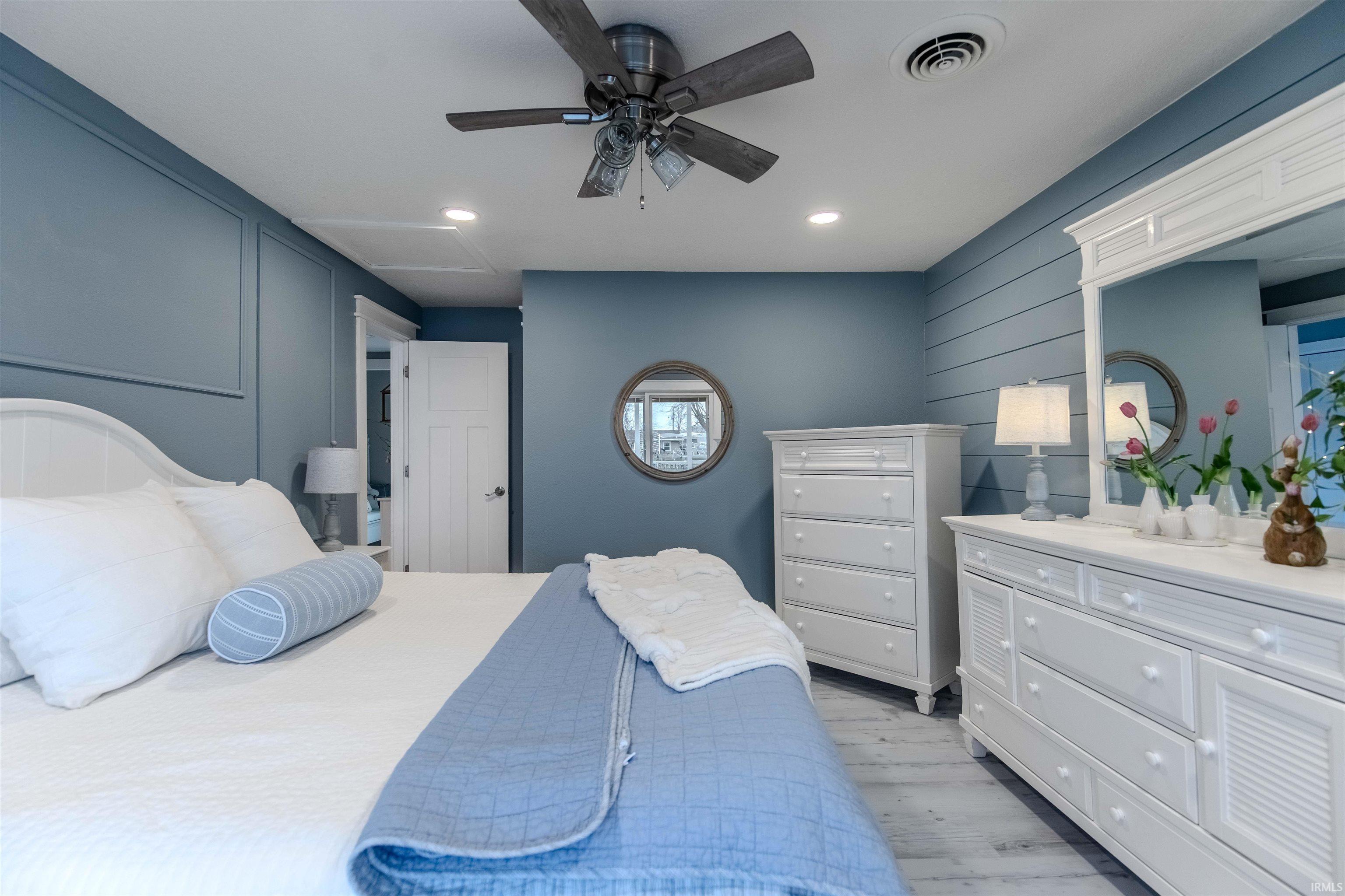 Bedroom with ceiling fan, recessed lighting, and light wood-style flooring