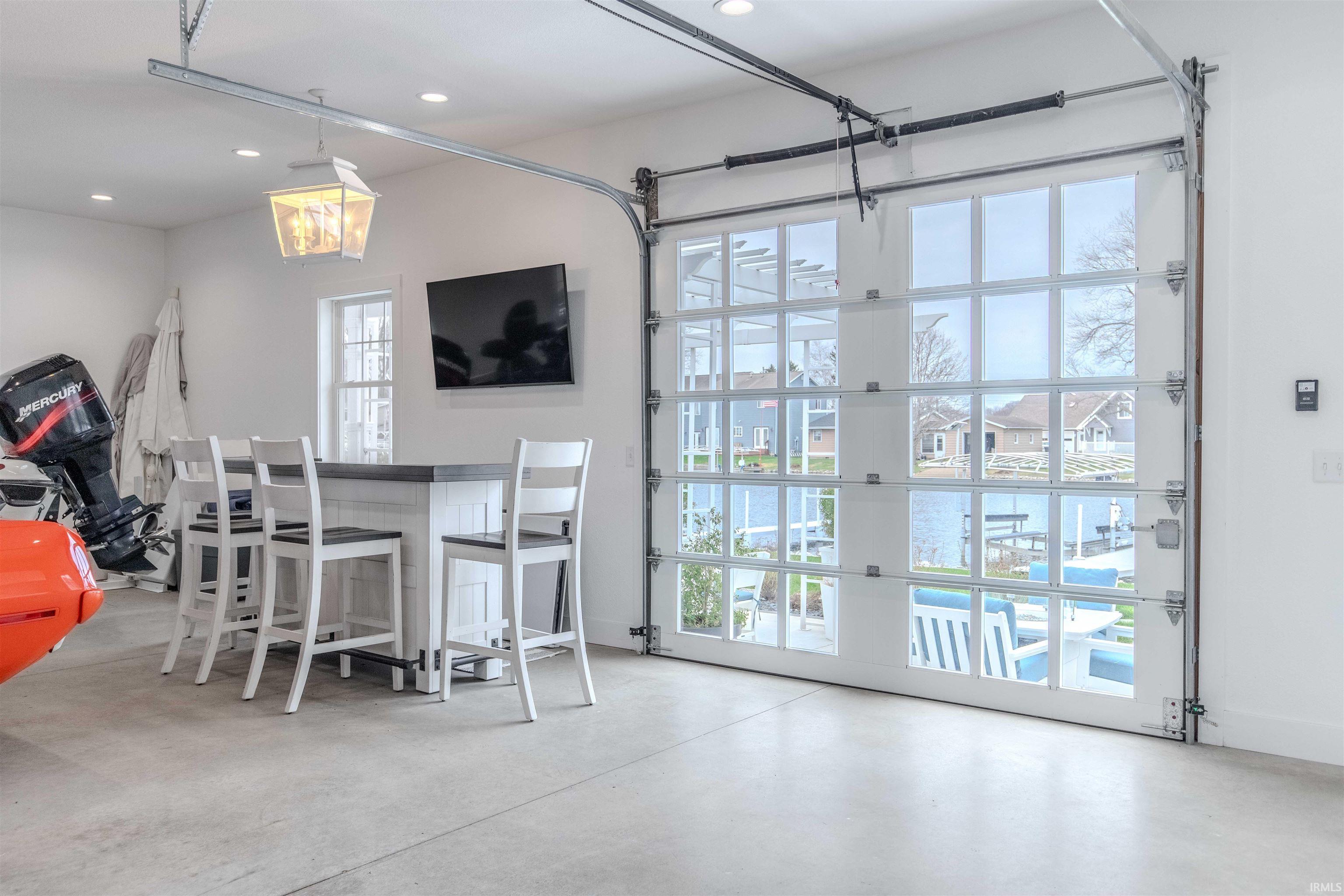 Dining area with finished concrete floors and recessed lighting