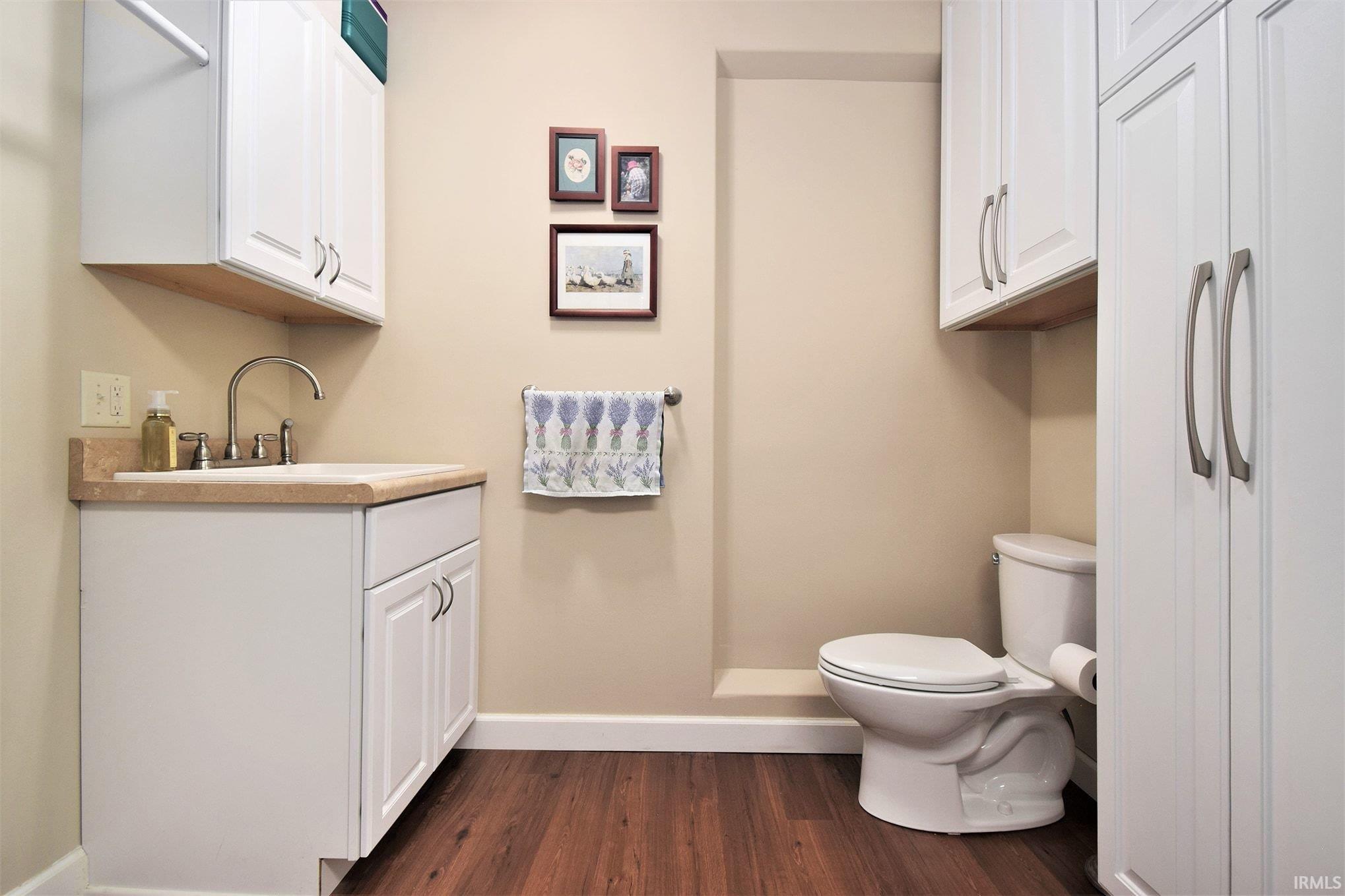 Bathroom with vanity and dark wood finished floors