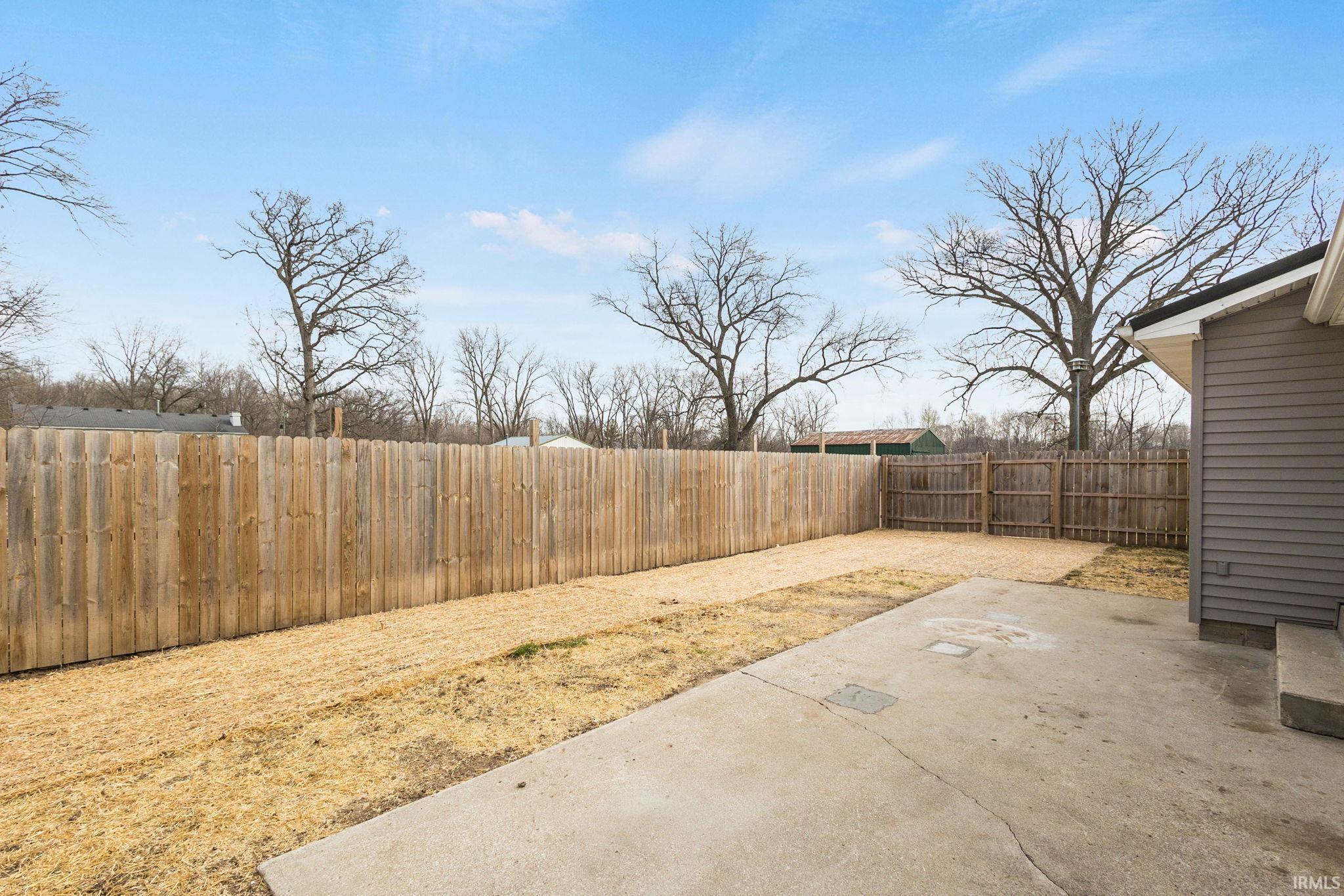 Fenced backyard featuring a patio area