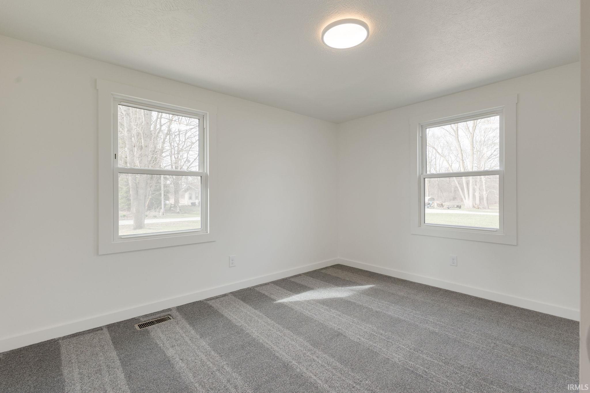 Bedroom featuring carpet floors and healthy amount of natural light