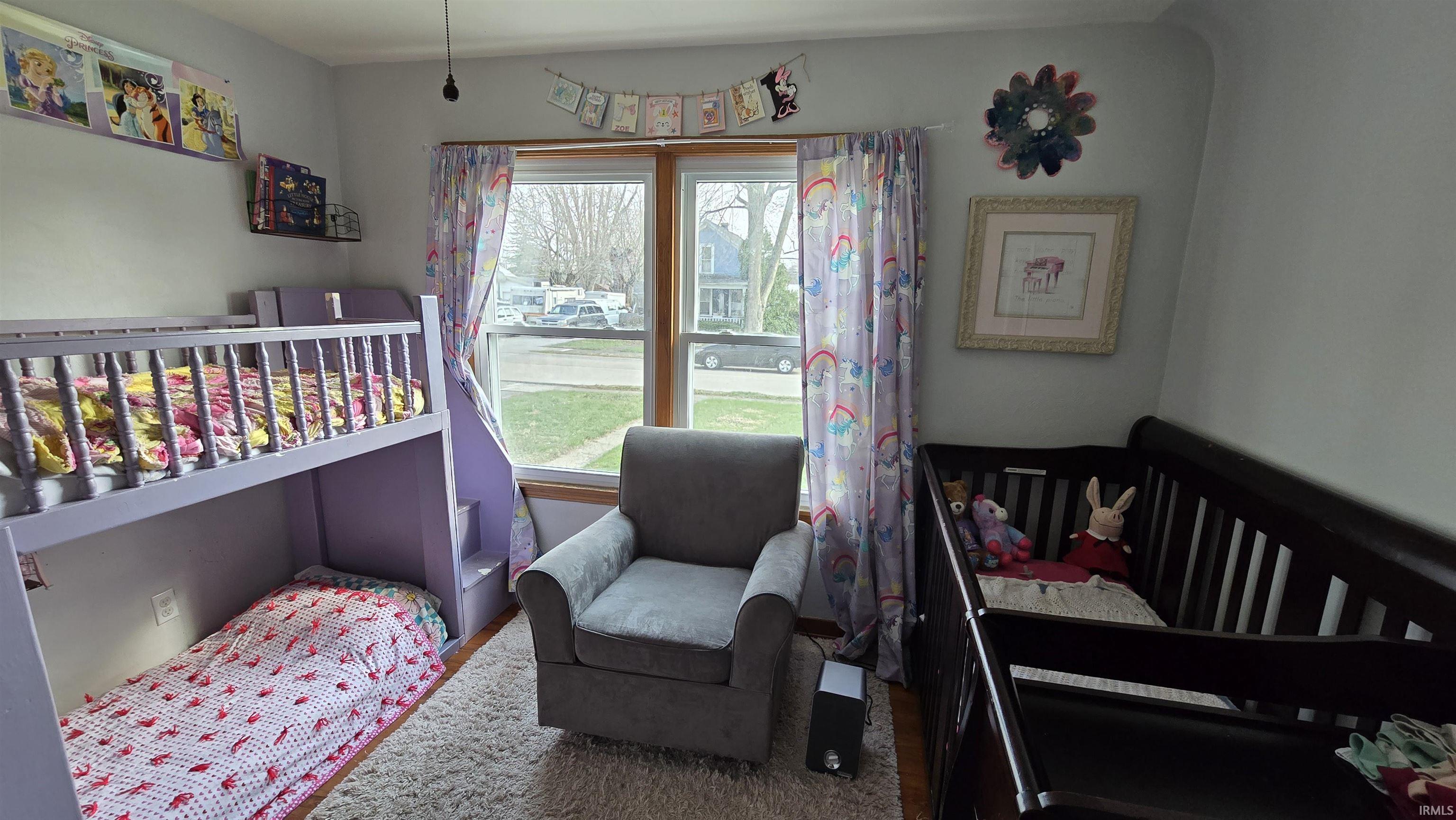 Bedroom with a nursery area